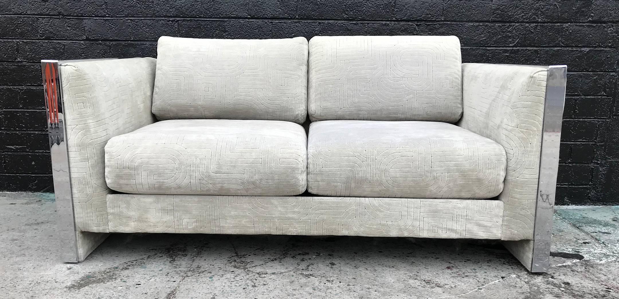 A gorgeous sofa by Selig Monroe. This 1970s sofa features chrome accented sides, and a bold tone on tone geometric patterned light grey velvet upholstery.