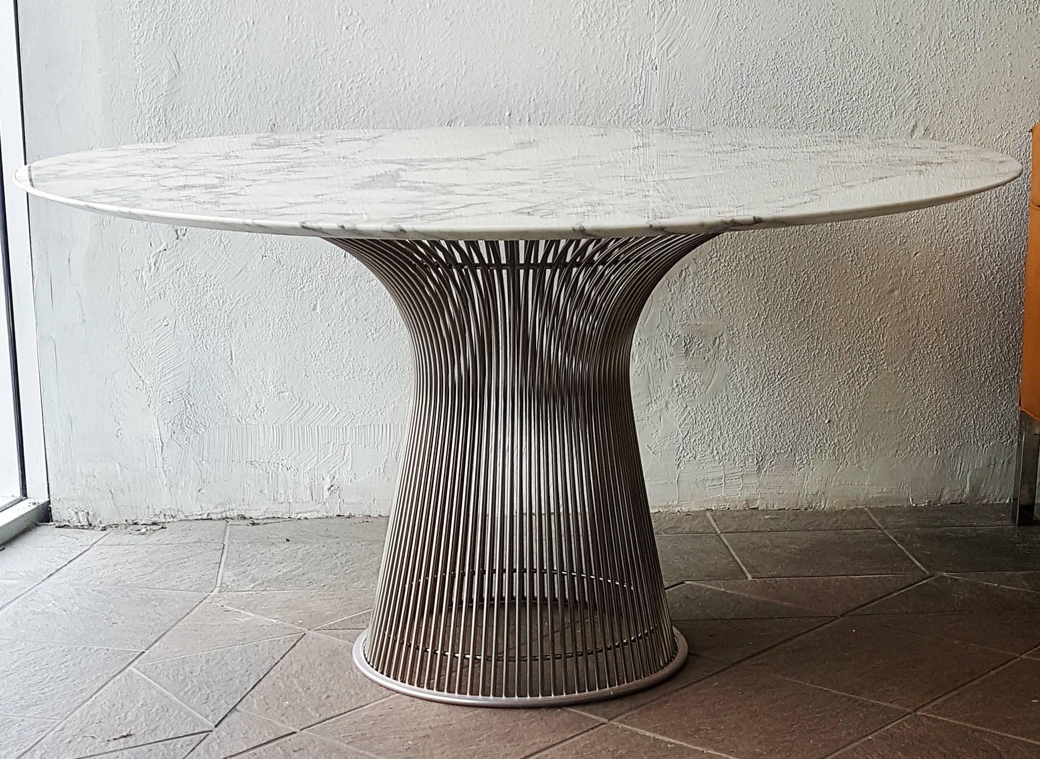 A truly stunning dining table, Warren Platner for Knoll polished nickel and steel base dining table with a stunning veined Italian Arabescato marble top.