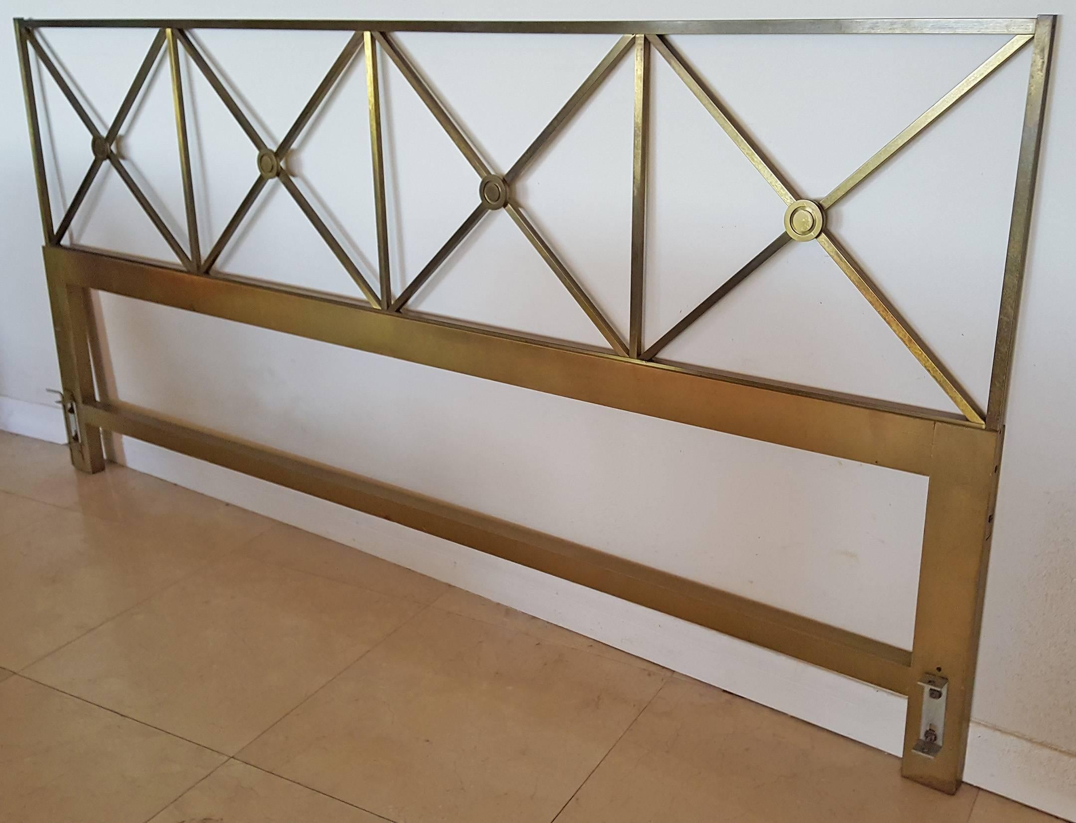 A stunning brass geometric style headboard with a Tommi Parzinger style flair. A timeless piece that has a wonderful patina.