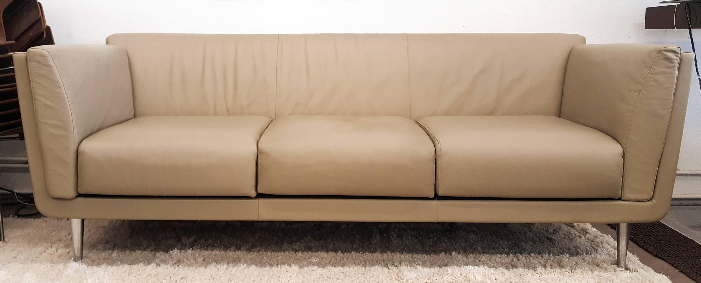 A stunning example of modern design, this sofa designed by Mark Goetz for Herman Miller has the clean lines and modern style that make this sofa a timeless classic. The sofa is encased in a cherrywood that wraps the sides as well as the back of the