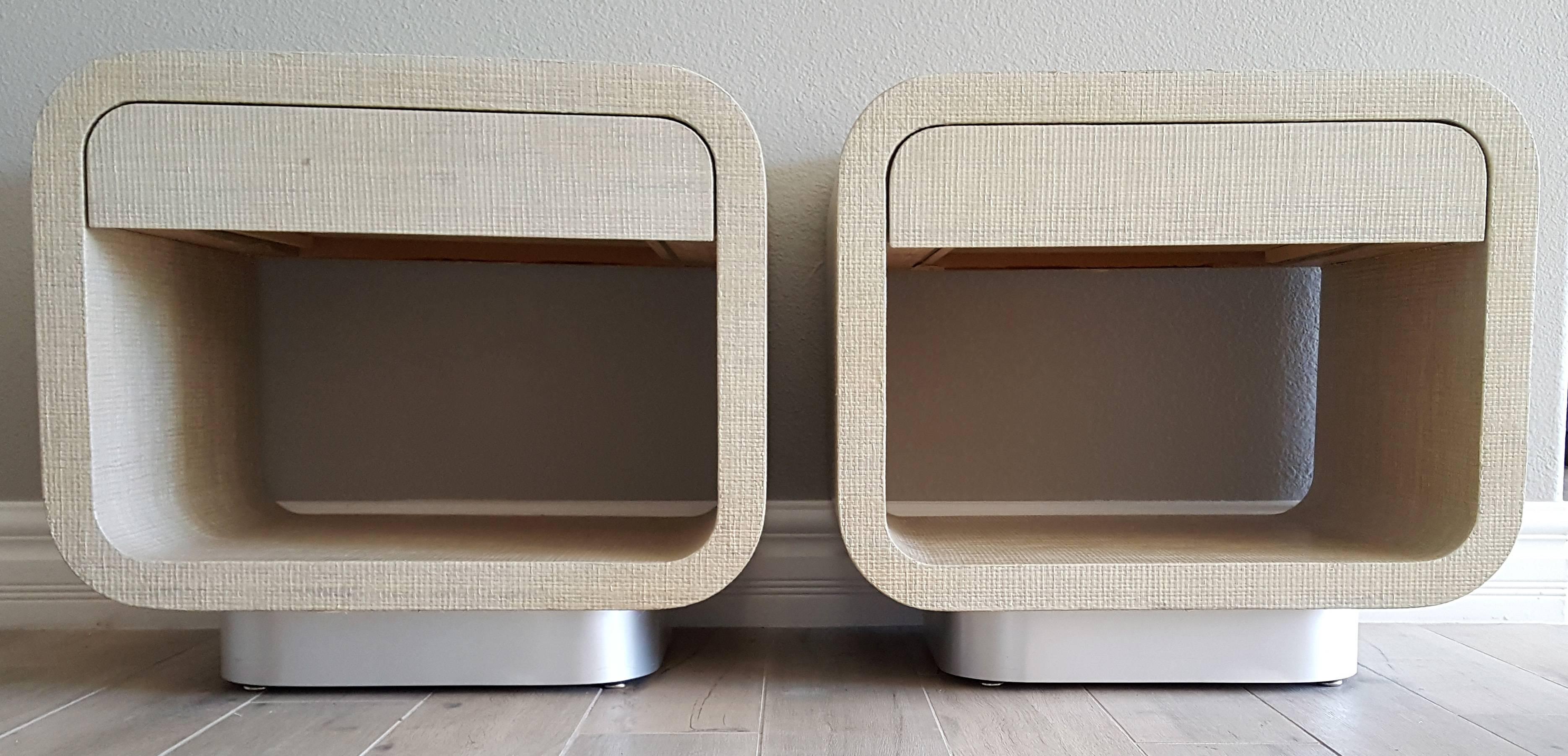 A stunning pair of Harrison Van Horn modern/contemporary nightstands covered in raffia with a brushed chrome base. These could also be used as side tables.