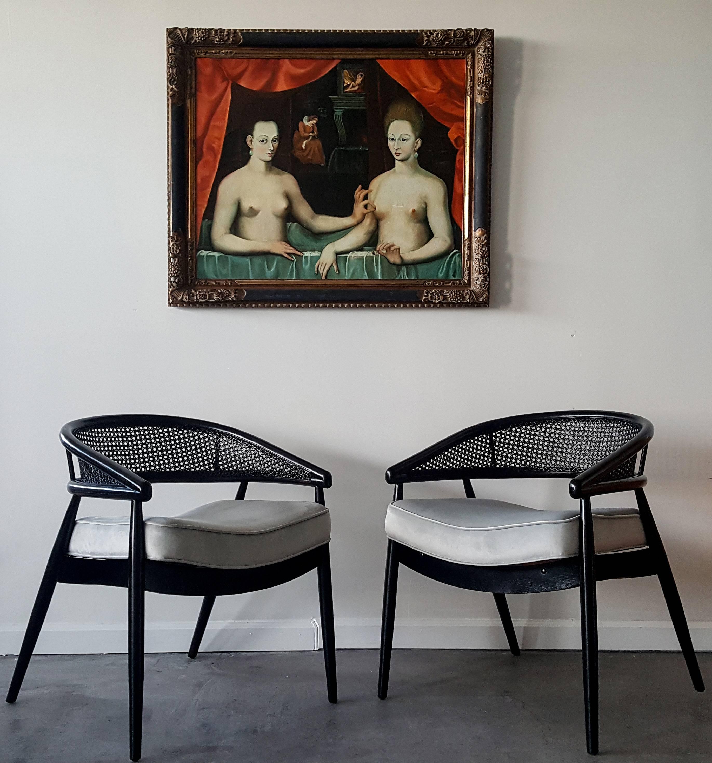 A stunning pair of lounge chairs designed by James Mont. The chairs are upholstered in a luxurious dove grey velvet and are equally as comfortable as they are beautiful. 

This chair style was used by James Mont for the King Cole Penthouse