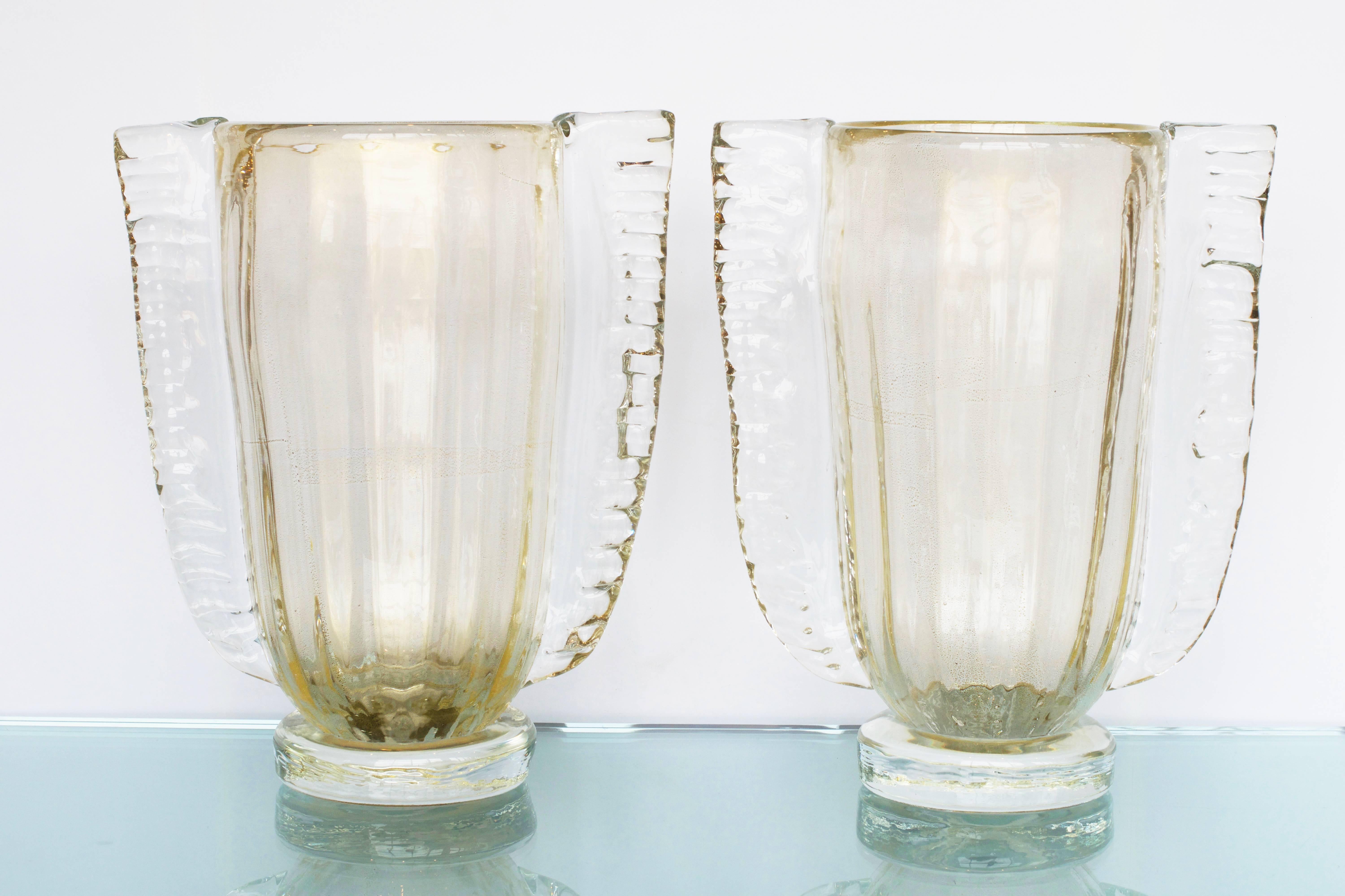 Murano hand blown vases of opaline glass made by prestigious Italian glassblower, Sergio Costantini. Clear glass with polvere d'oro (23-karat gold leaf flecks) is layered over white opaline glass, creating beautiful 