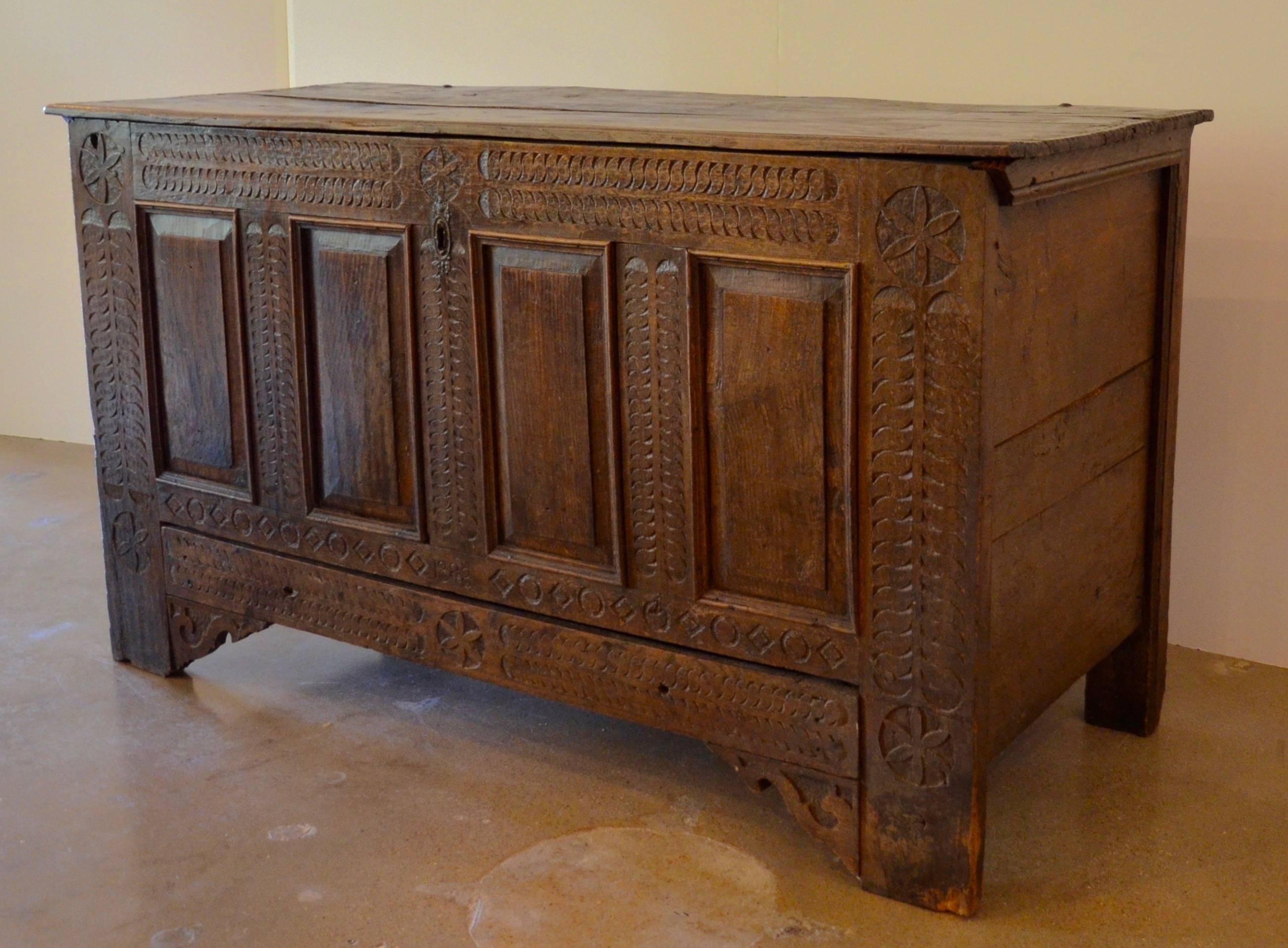 German Pennsylvania also known as Pennsylvania Dutch dowry chest, blanket chest or coffer. Large-scale, in the chip carved Pennsylvania style typical of the early 18th century. Drawer at base. Size appropriate for use as sideboard. Measures: 5'.

 