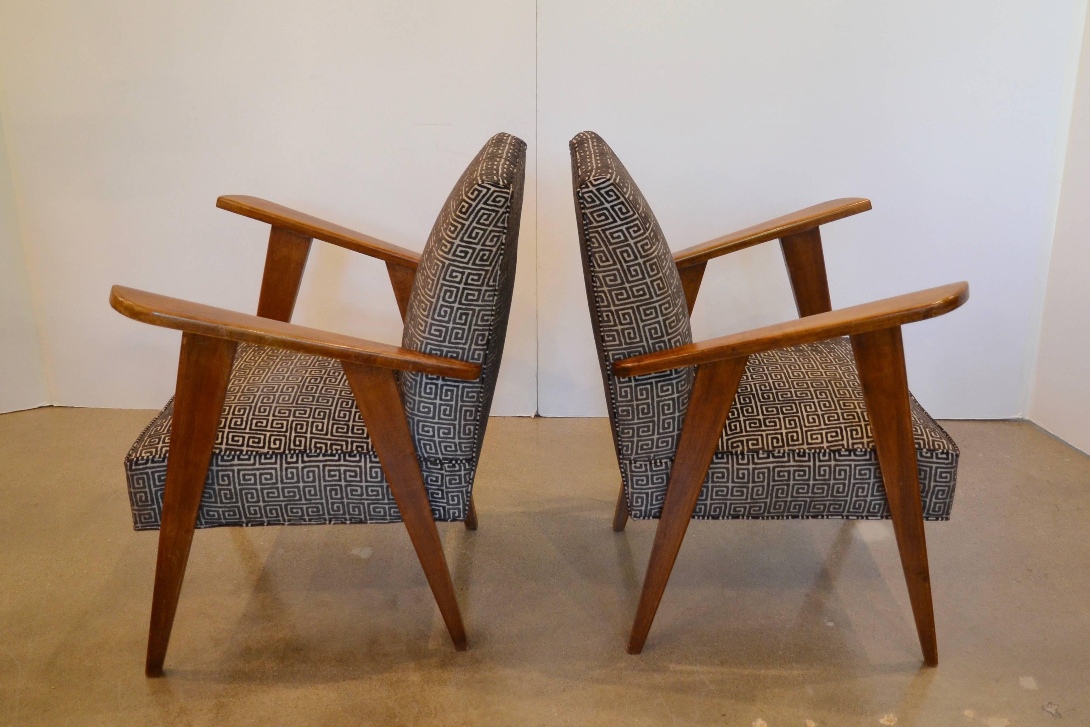 Handsome Italian Mid-Century Modern chairs, circa 1950, with open arms on angular frame reminiscent of Jeanneret.  New custom Greek key upholstery in black and tan cut velvet.  Very comfortable.