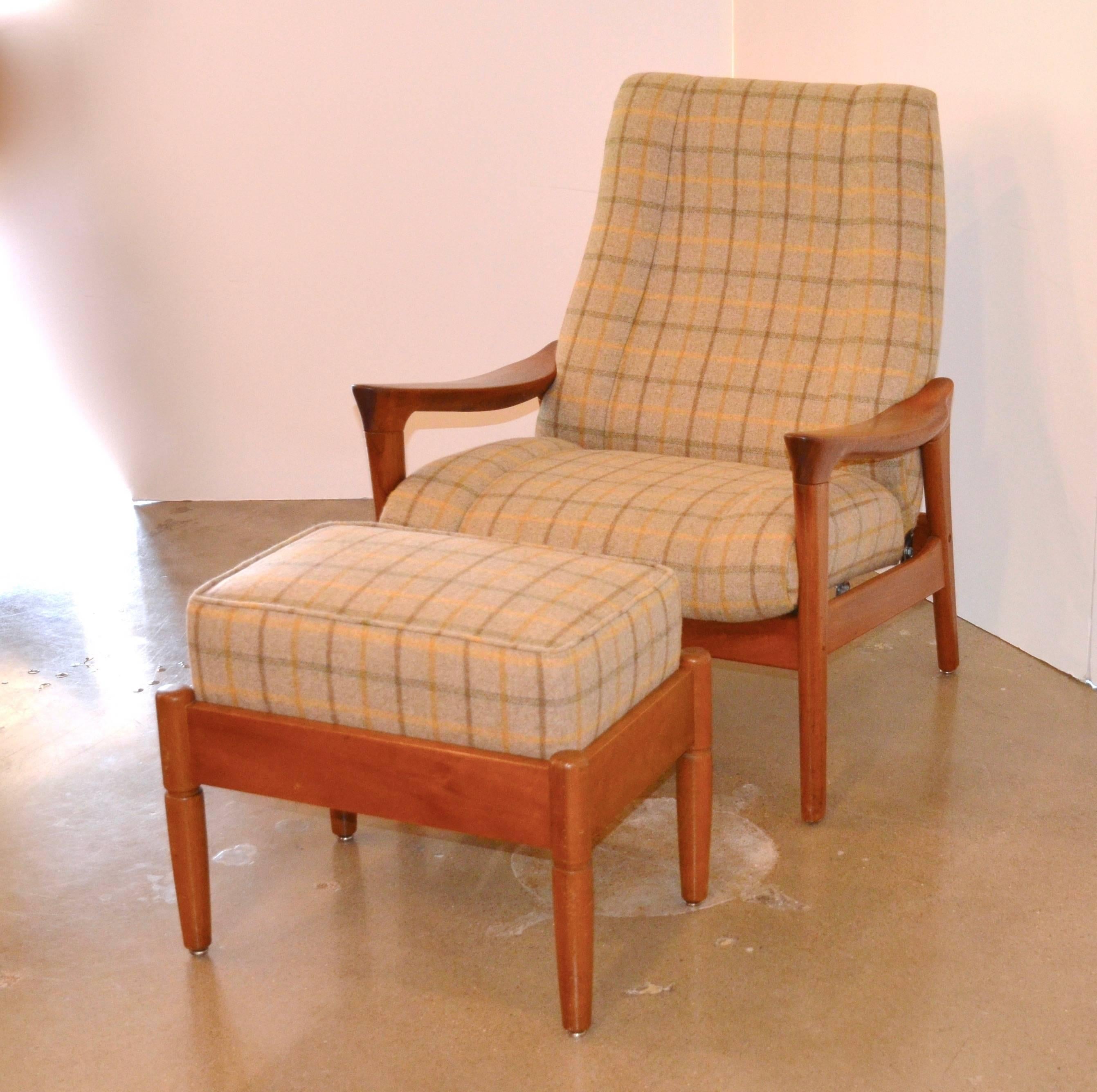 1960s, Danish lounge chair with wood frame (teak or oak) and reclining action, paired with ottoman of similar vintage and appearance. Newly reupholstered in Ralph Lauren wool plaid. Ottoman measures 15.5" W x 22.5" L x 18.5" H.