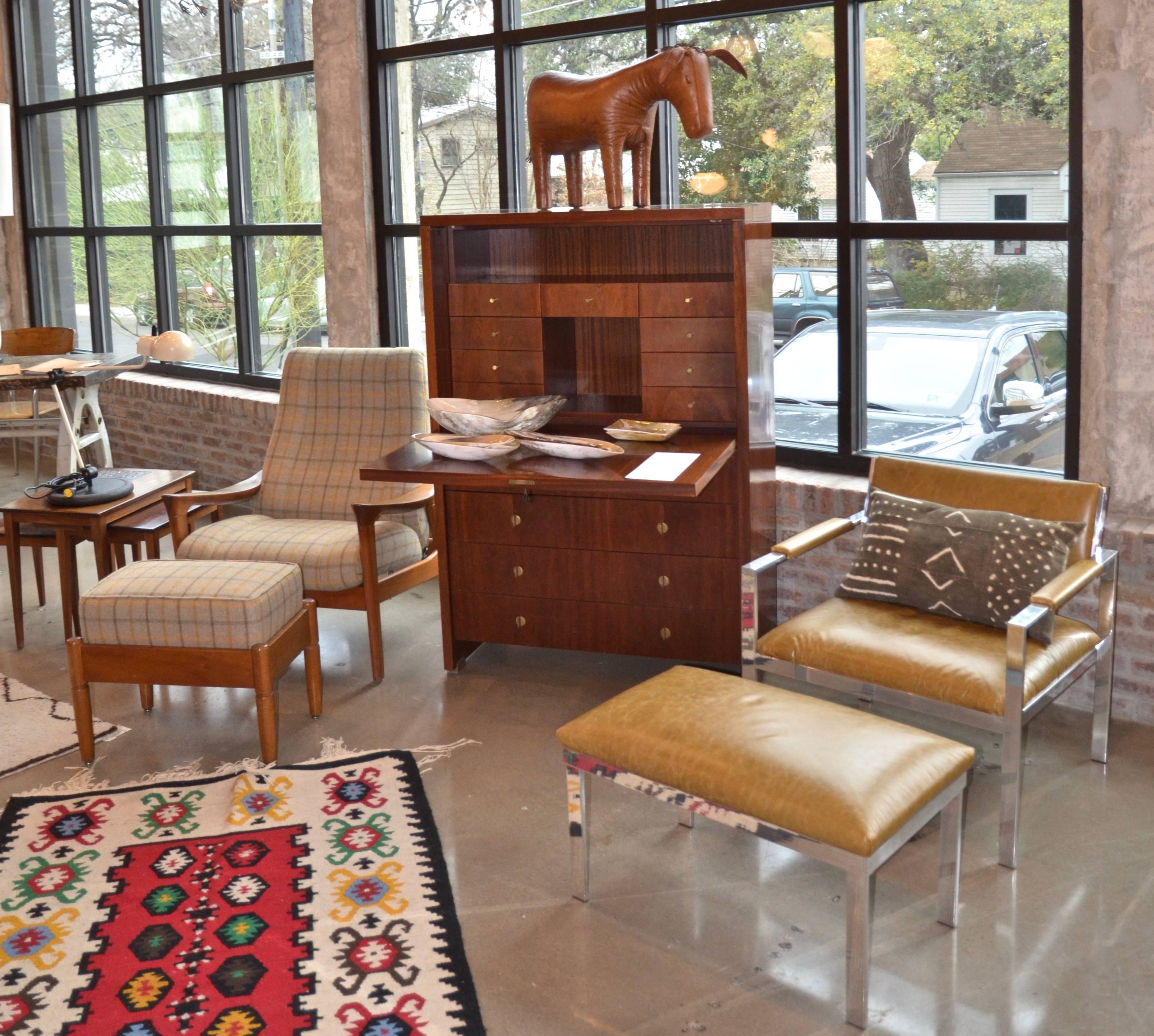 Polished aluminium/chrome frame lounge chair and ottoman with new olive colored leather upholstery. In the style of Milo Baughman and Harvey Probber, 1970s. As sturdy and comfortable as it is good looking.