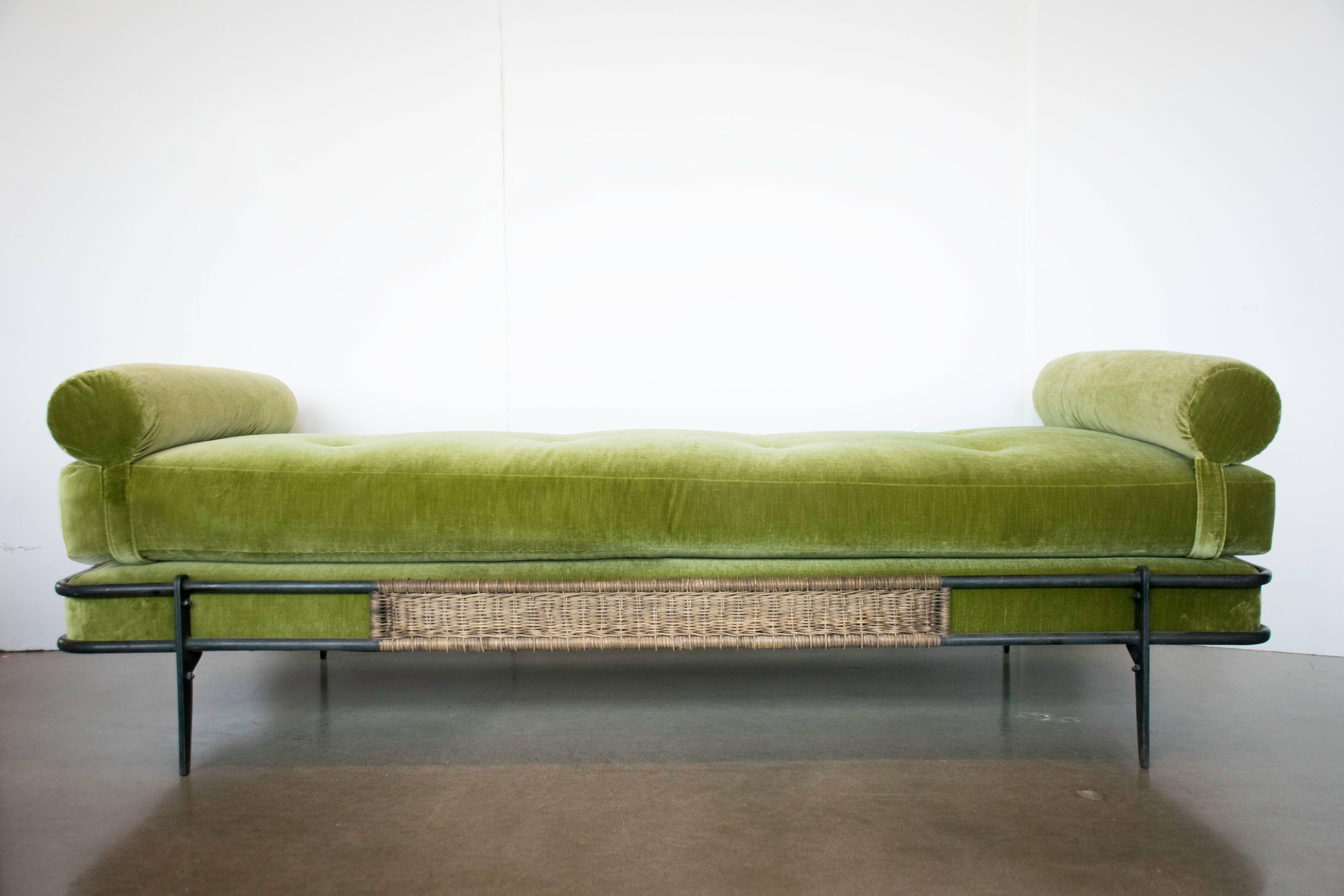 Rare, elegant daybed by renowned Hungarian-French designer, Mathieu Matégot (1910-2001). Enameled steel with woven wicker panels on each side. Custom upholstery in Great Plains Vanity Fair velvet by Holly Hunt.
