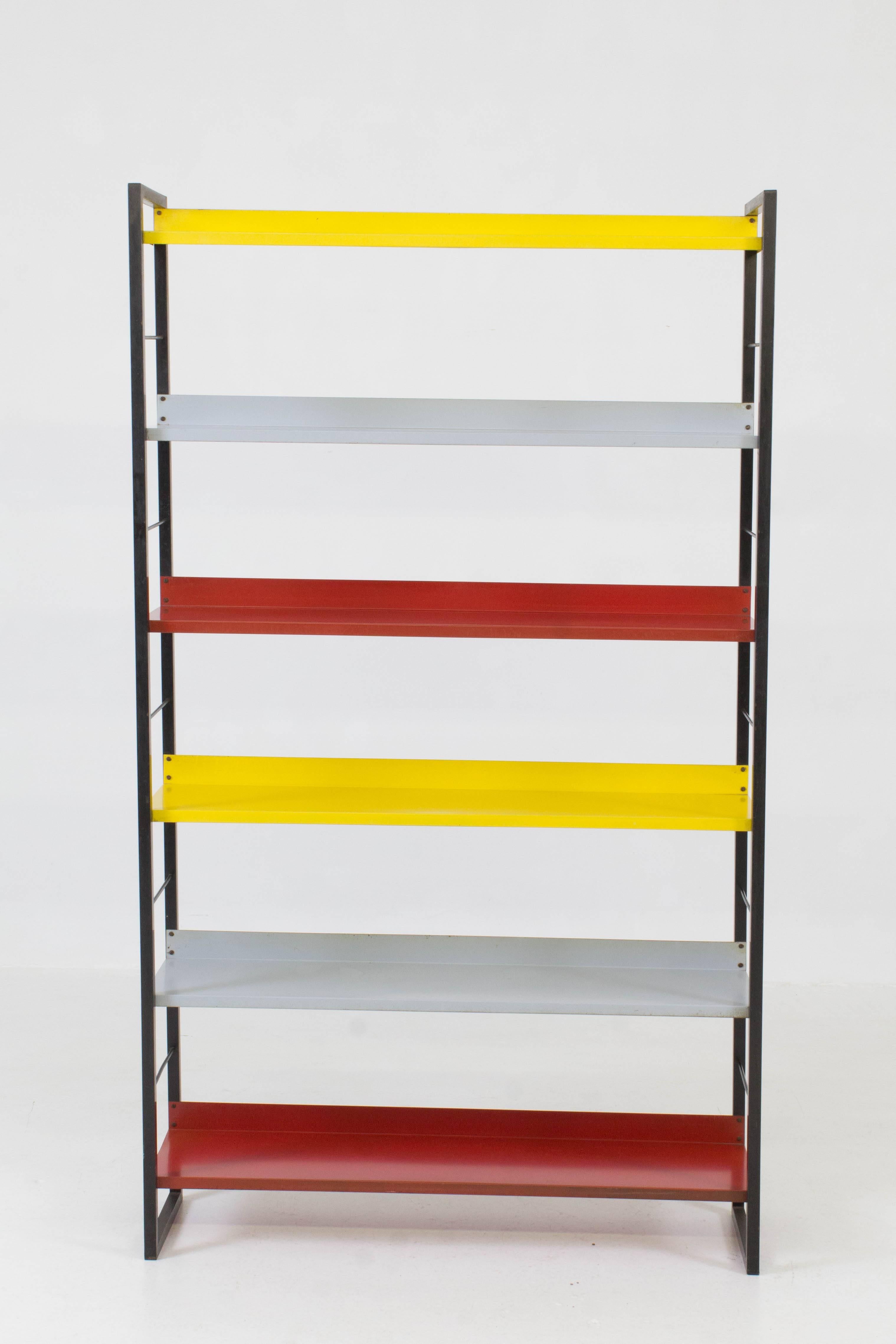 Mid-Century Modern multicolored metal standing bookshelf by Tomado, 1950s.
Black lacquered steel frame with Rietveld colored sheet metal shelves.
In good original condition with minor wear consistent with age and use,
preserving a beautiful