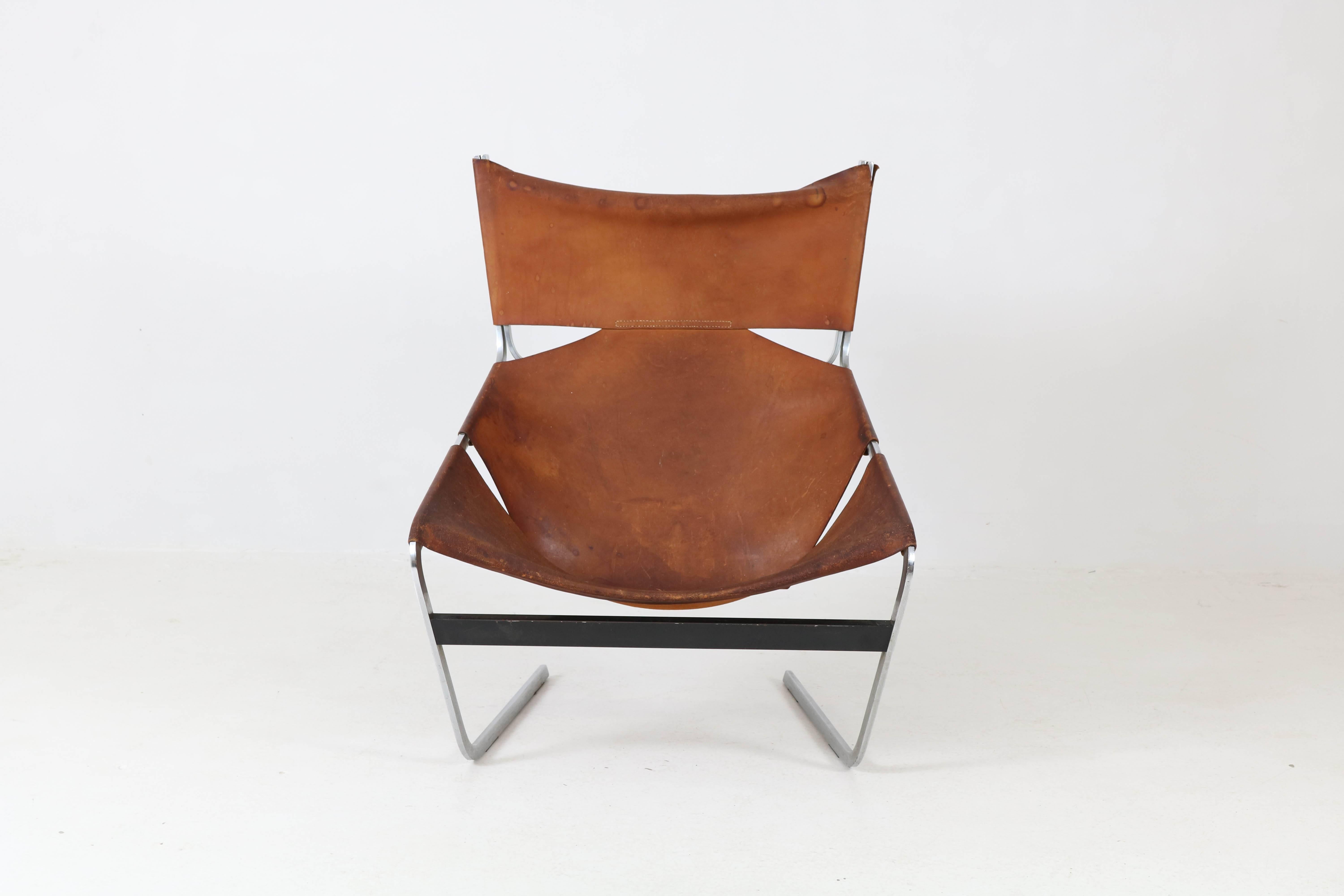 Mid-Century Modern F-444 lounge chair by Pierre Paulin for Artifort, 1960s.
Original leather upholstery with great patina.
Iconic design with comfortable seating.
Marked with Artifort label.
In fair condition with minor wear consistent with age