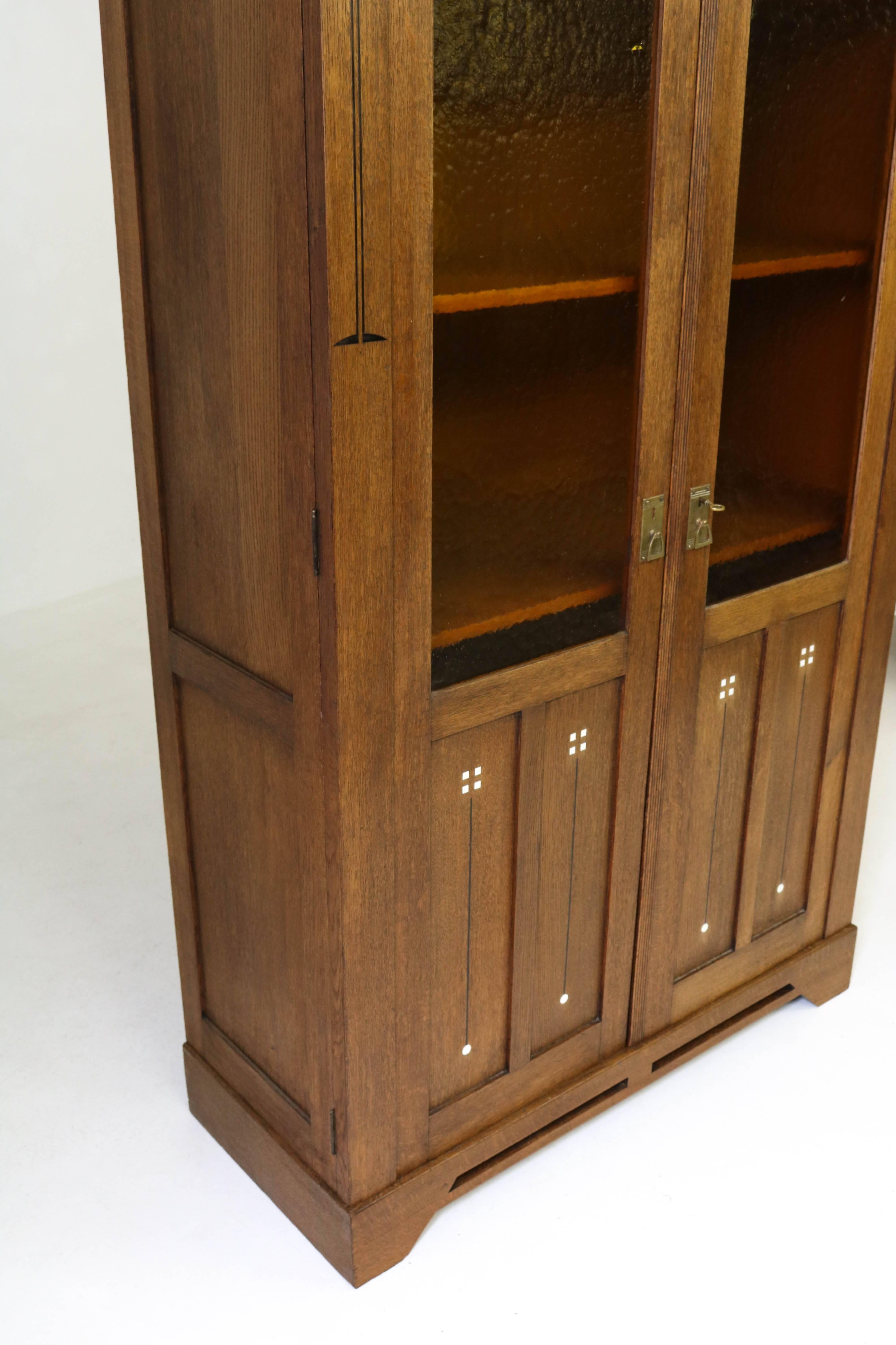 Early 20th Century Oak Dutch Art Nouveau Bookcase with Impressive Inlay