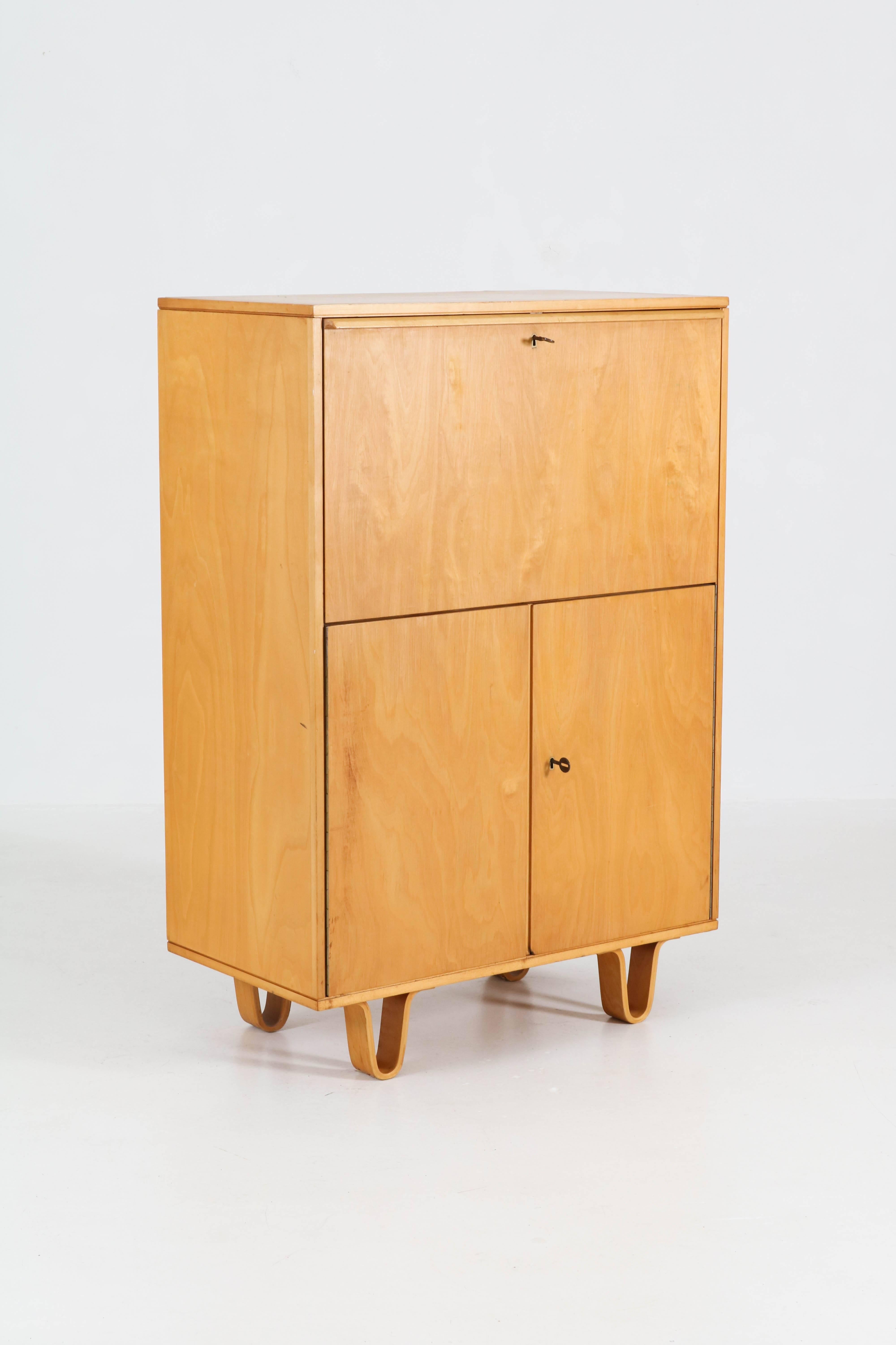 Elegant and rare Mid-Century Modern secretaire by Cees Braakman for Pastoe, 1950s.
From the well-known birch series with bentwood plywood legs.
Marked with metal tag and marked at the back.
In good original condition with minor wear consistent