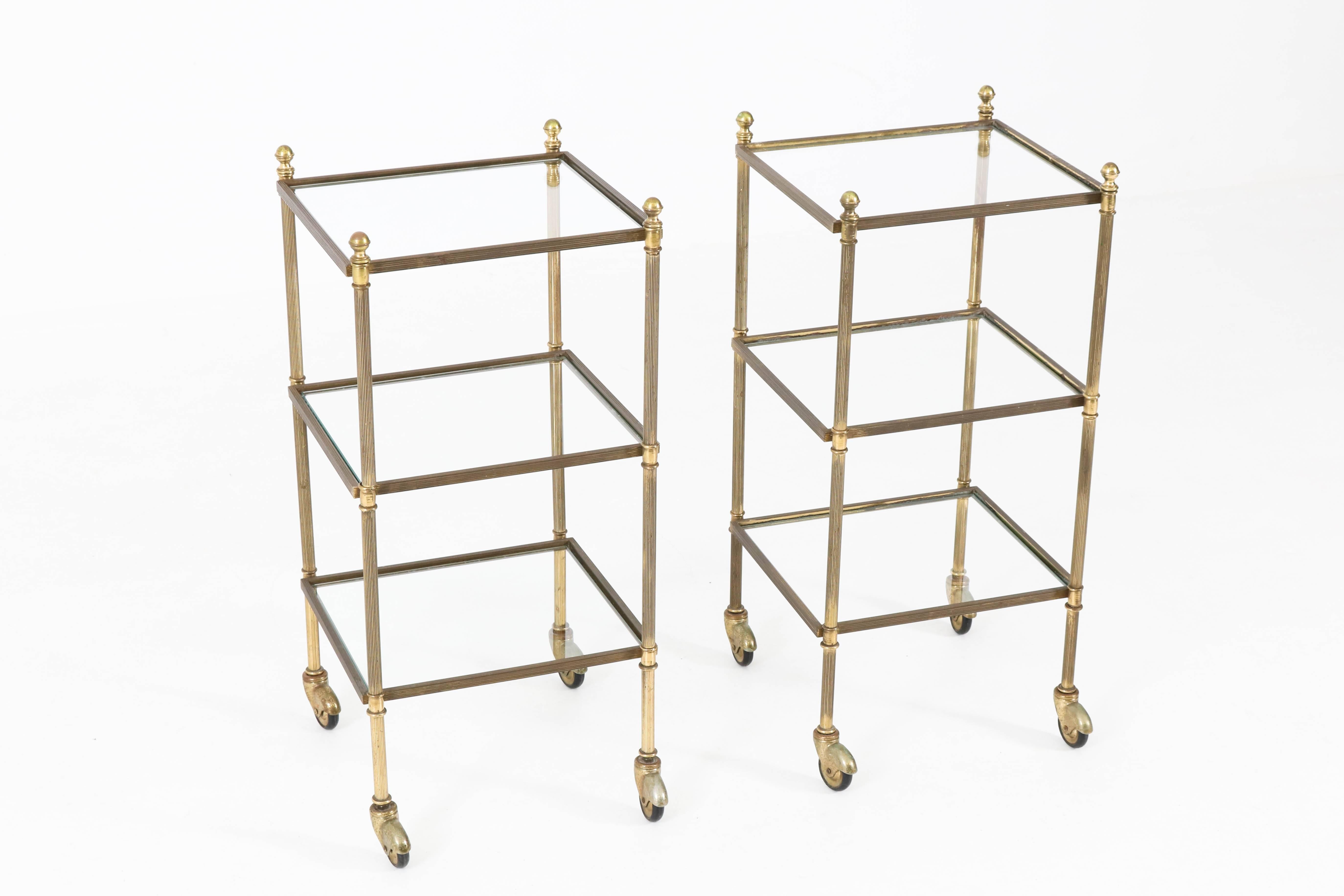 Wonderful pair of Mid-Century Modern Maison Jansen side tables, 1950s.
Solid brass three-tiered end tables with glass tops.
Elegant and functional design from the 1950s.
In good original condition with minor wear consistent with age and