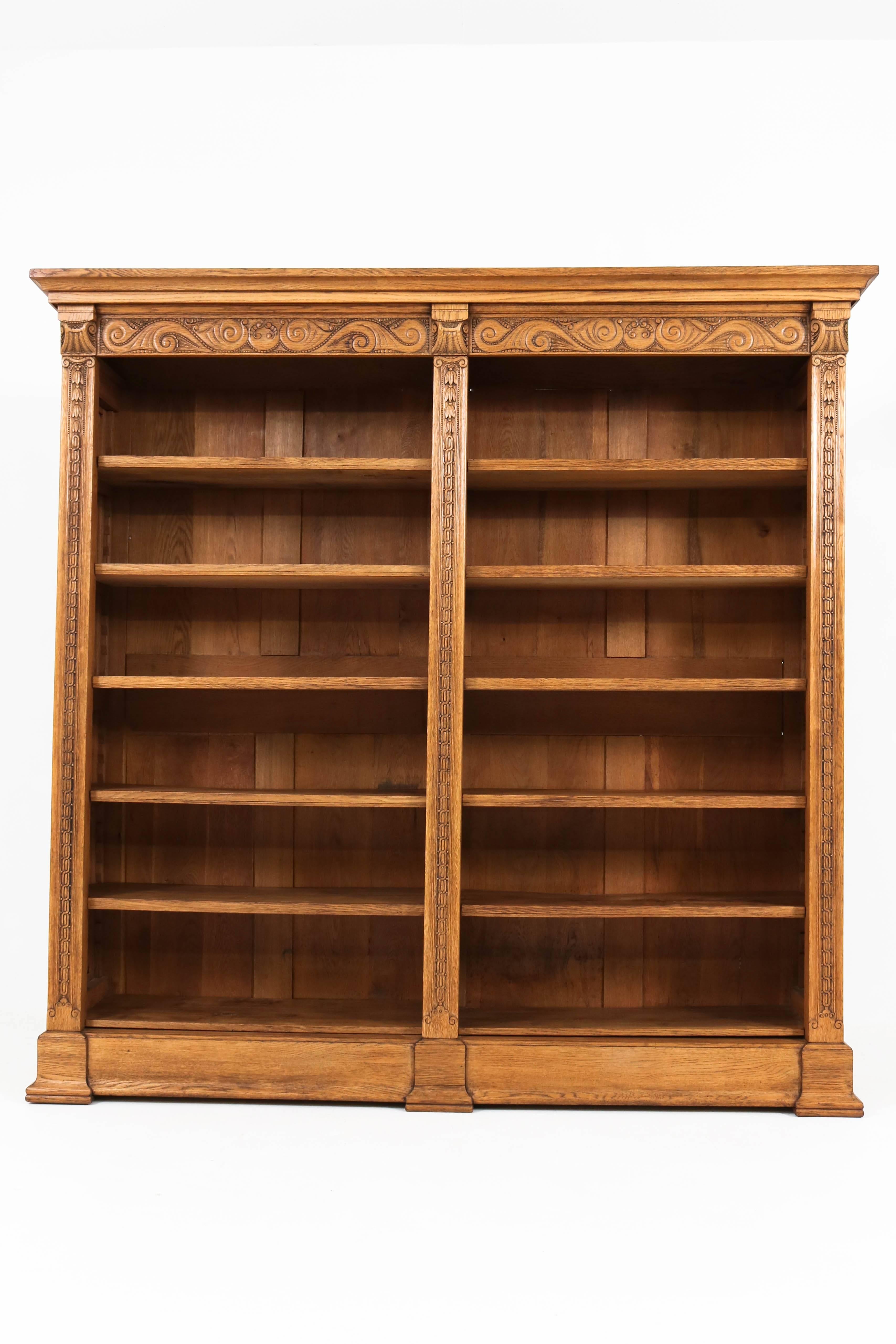 Impressive Dutch Art Nouveau open bookcase, 1900s.
Solid oak with fine carving.
Ten original adjustable wooden shelves.
This bookcase can be dismantled.
In good original condition with minor wear consistent with age and use,
preserving a