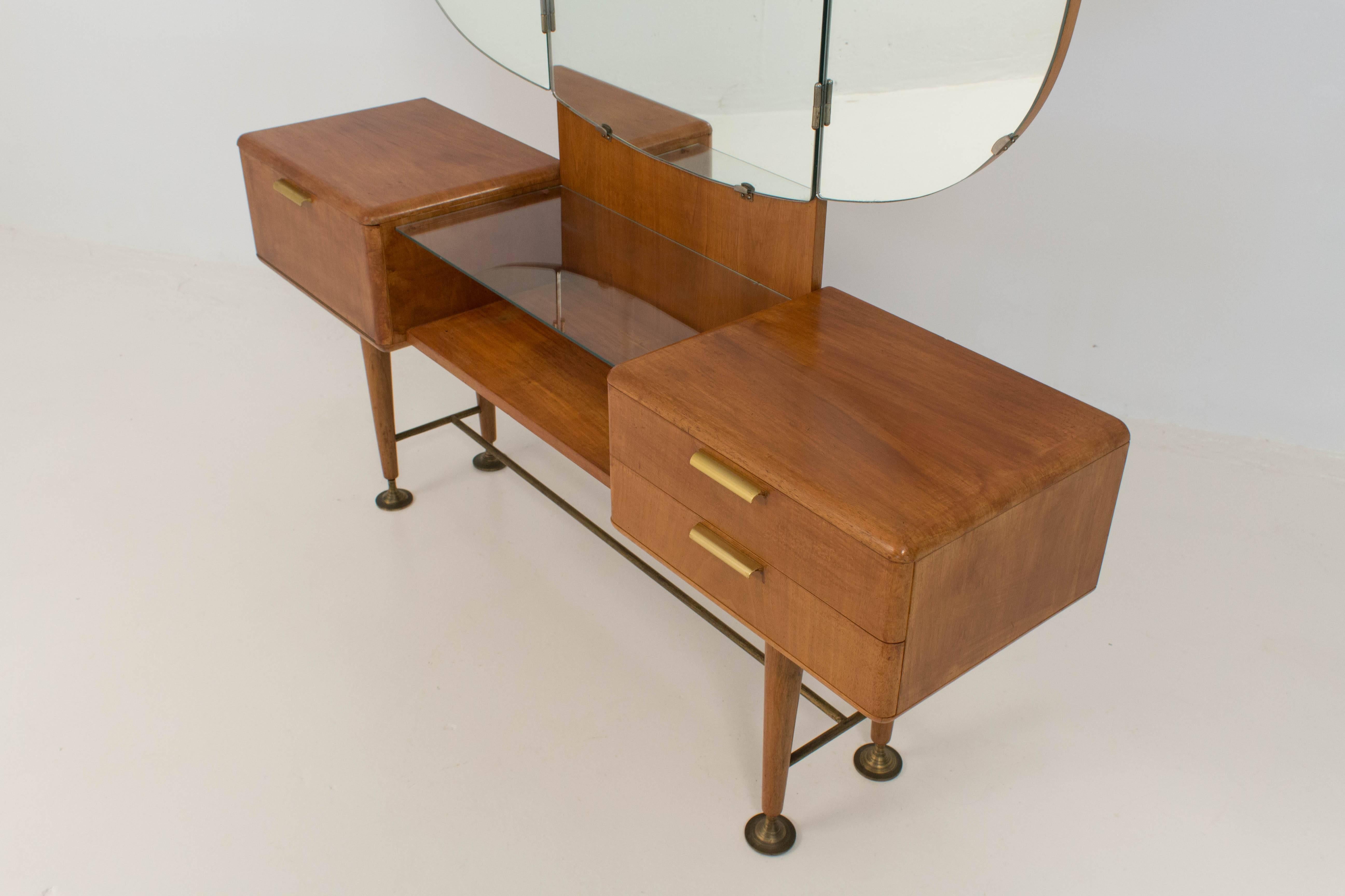 Rare walnut Mid-Century Modern vanity or dressing table by A.A. Patijn for Zijlstra.
With solid brass feet and original mirrors.
In good condition.