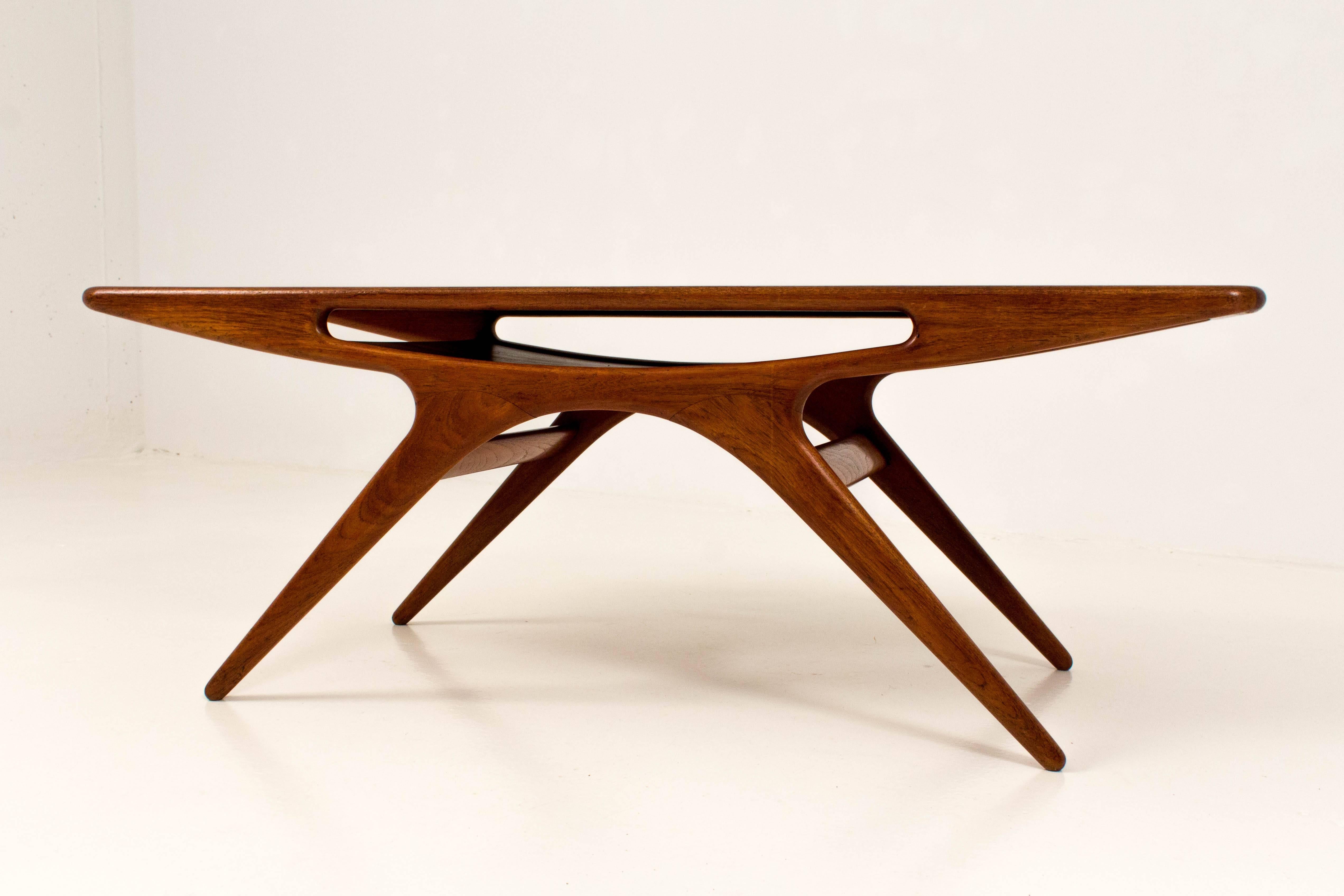 Iconic Smile teak coffee table by Johannes Andersen for CFC Silkeborg, Denmark, 1957.
The magazine shelf is moulded into the table, giving it a smile effect.
In very good condition with minor wear consistent with age and use,
preserving a