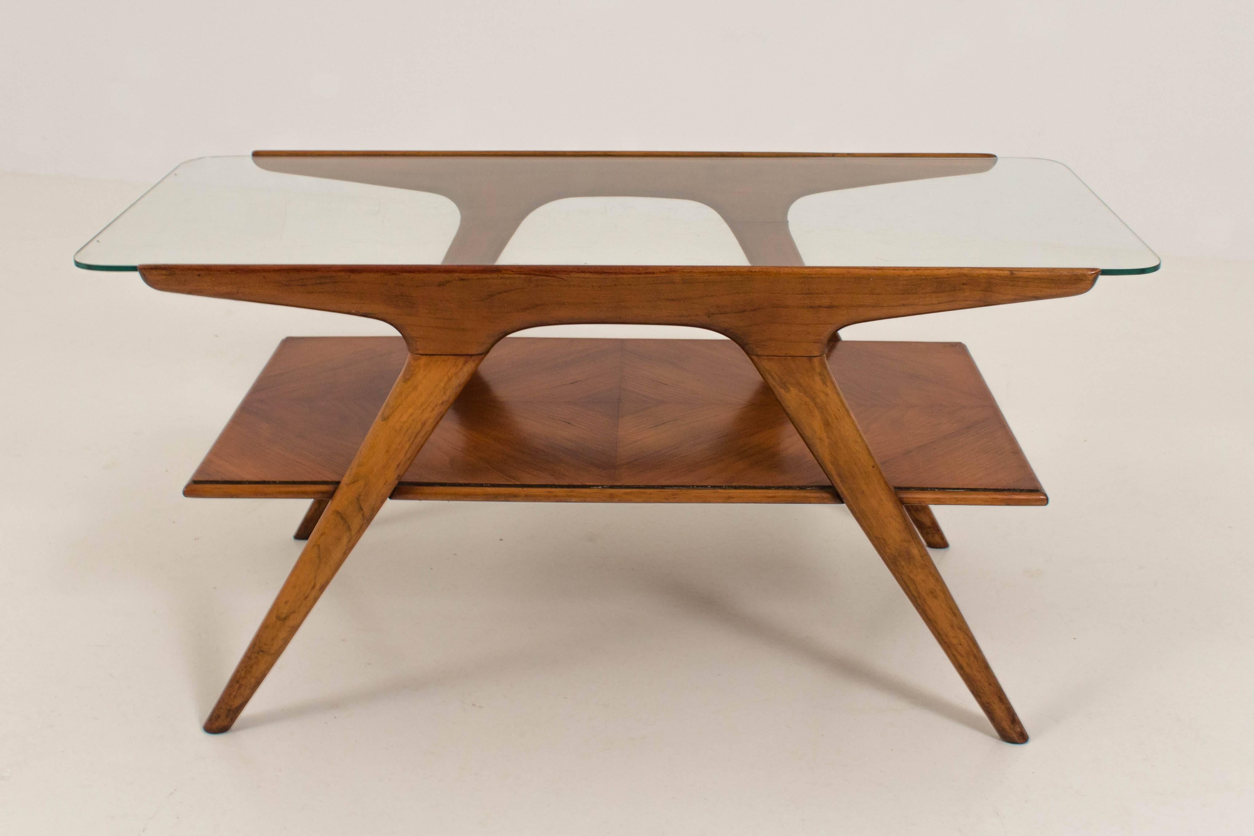 Funky Mid-Century Modern coffee table by Cesare Lacca for Cassina.
Walnut frame with original glass top.
In good original condition with minor wear consistent with age and use,
preserving a beautiful patina.