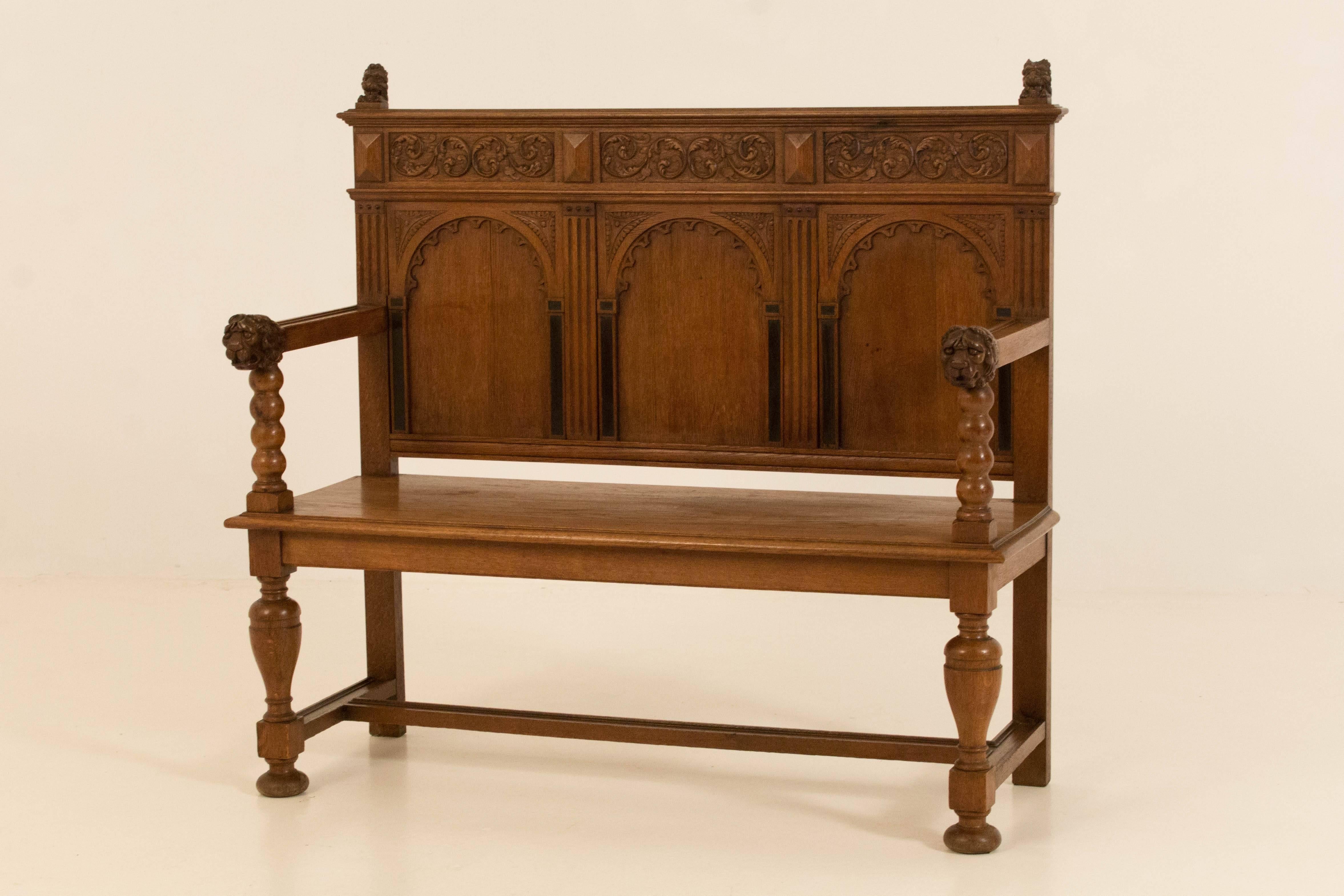 Dutch neo Renaissance carved hall bench, 1900s.
Solid oak with nicely carved armrests.
In good original condition with minor wear consistent with age and use,
preserving a beautiful patina.