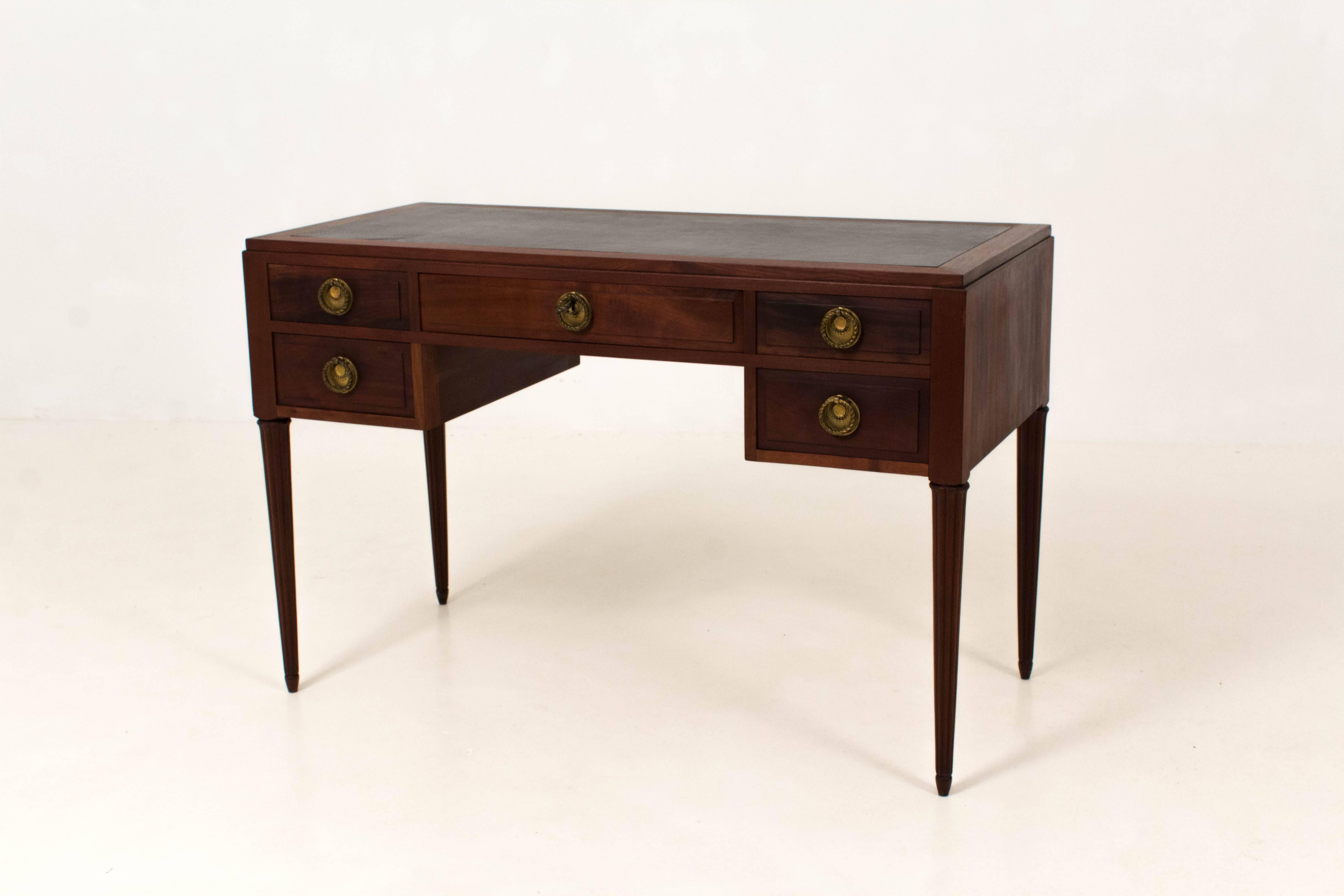 Stunning Art Deco ladies desk with black leather top.
Solid mahogany with original brass handles.
In good original condition with minor wear consistent with age and use,
preserving a beautiful patina.