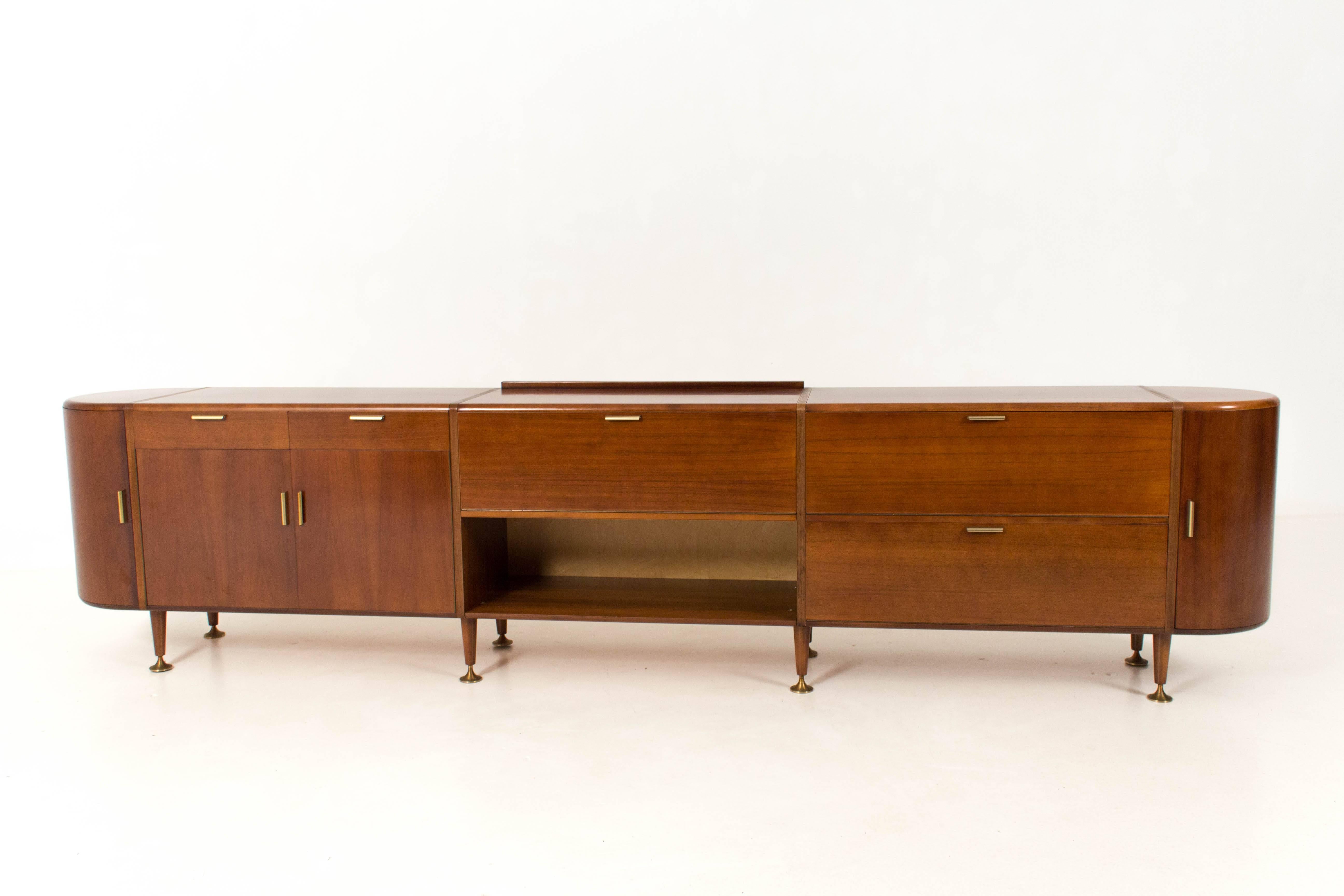 Extra large walnut Mid-Century Modern sideboard by A.A.Patijn for Poly-Z 1960s.
Original brass handles on the doors.
In good condition with minor wear consistent with age and use,
preserving a beautiful patina.
