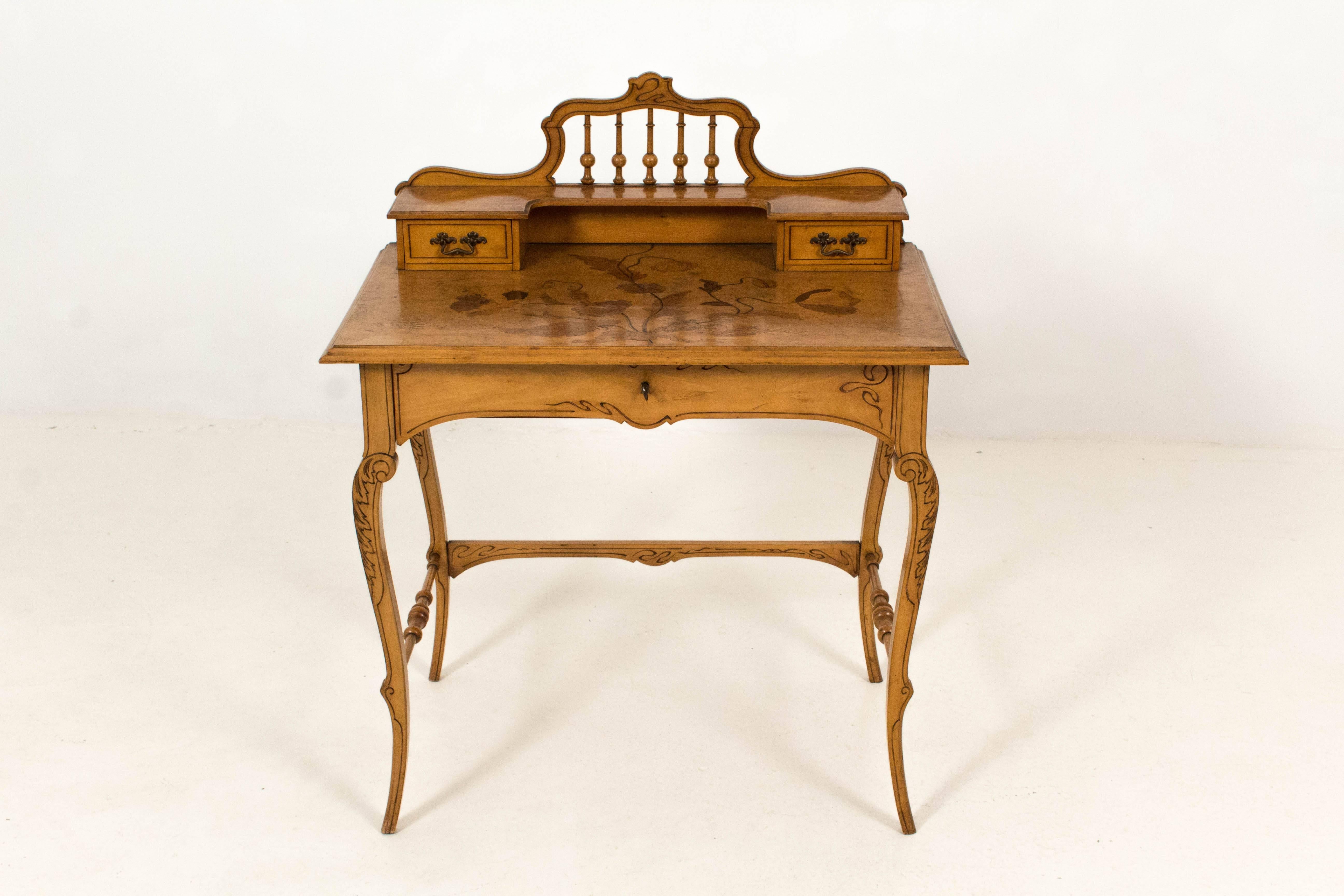 Stunning French Art Nouveau writing table with marquetry, 1900s.
Walnut or Ash with three original drawers.
In good original condition with minor wear consistent with age and use,
preserving a beautiful patina.
   