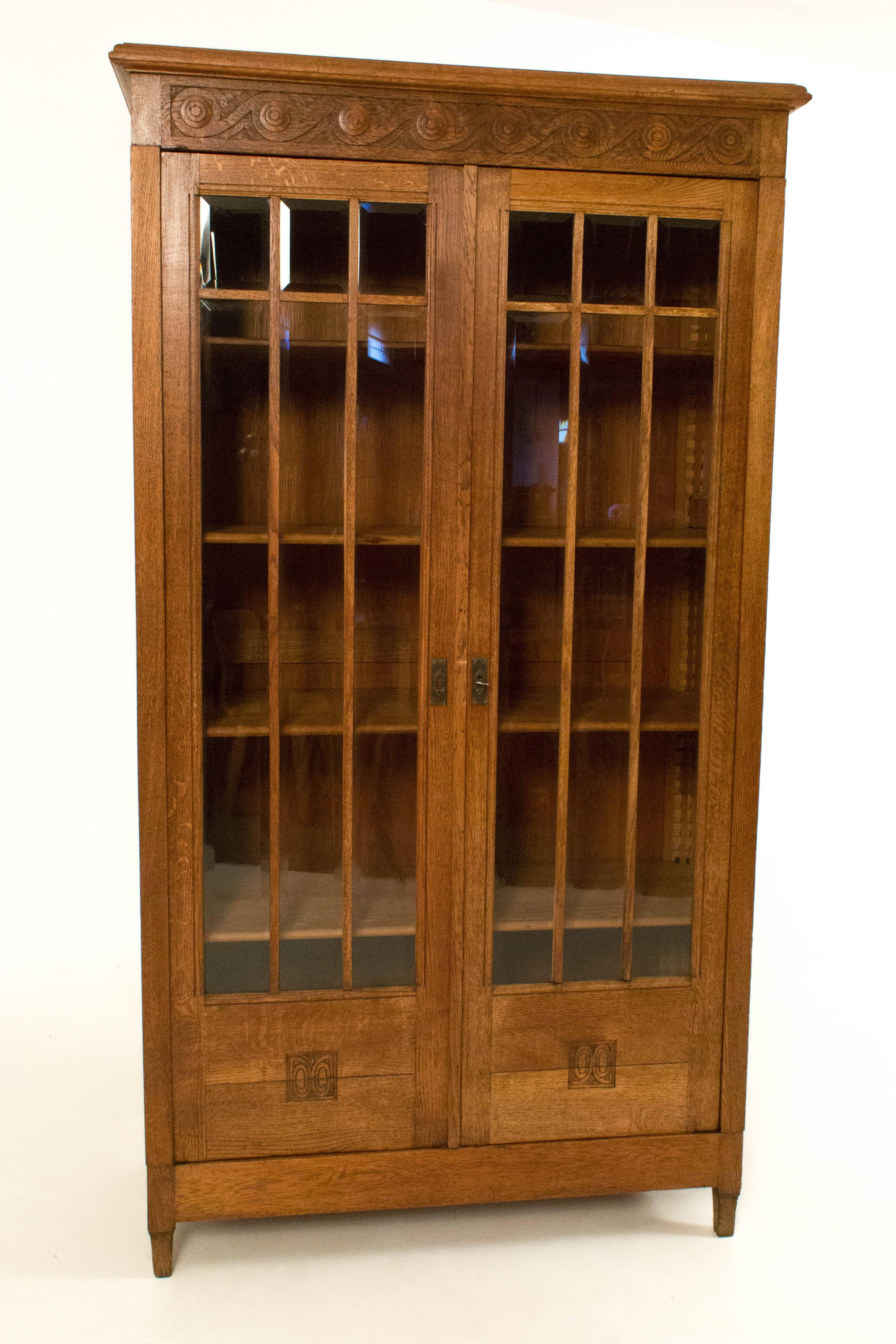 Stunning French Art Nouveau bookcase, 1900s.
With original beveled glass.
Bookcase can be taken apart into eleven pieces.
In good original condition with minor wear consistent with age and use,
preserving a beautiful patina.
