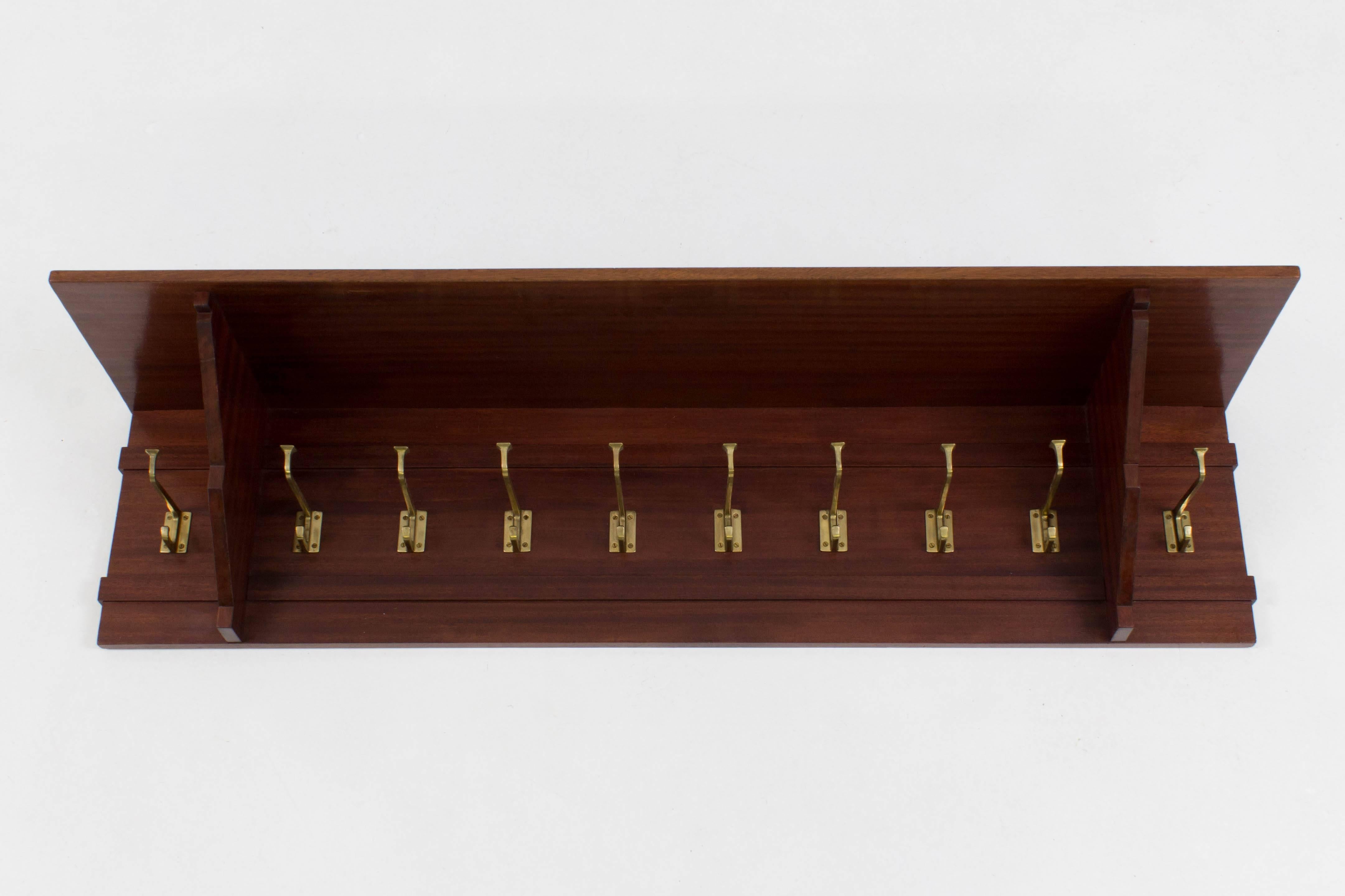 Dutch Art Deco Amsterdam School coat rack 1920s.
Solid mahogany with ten original solid brass hooks.
In good original condition with minor wear consistent with age and use,
preserving a beautiful patina.