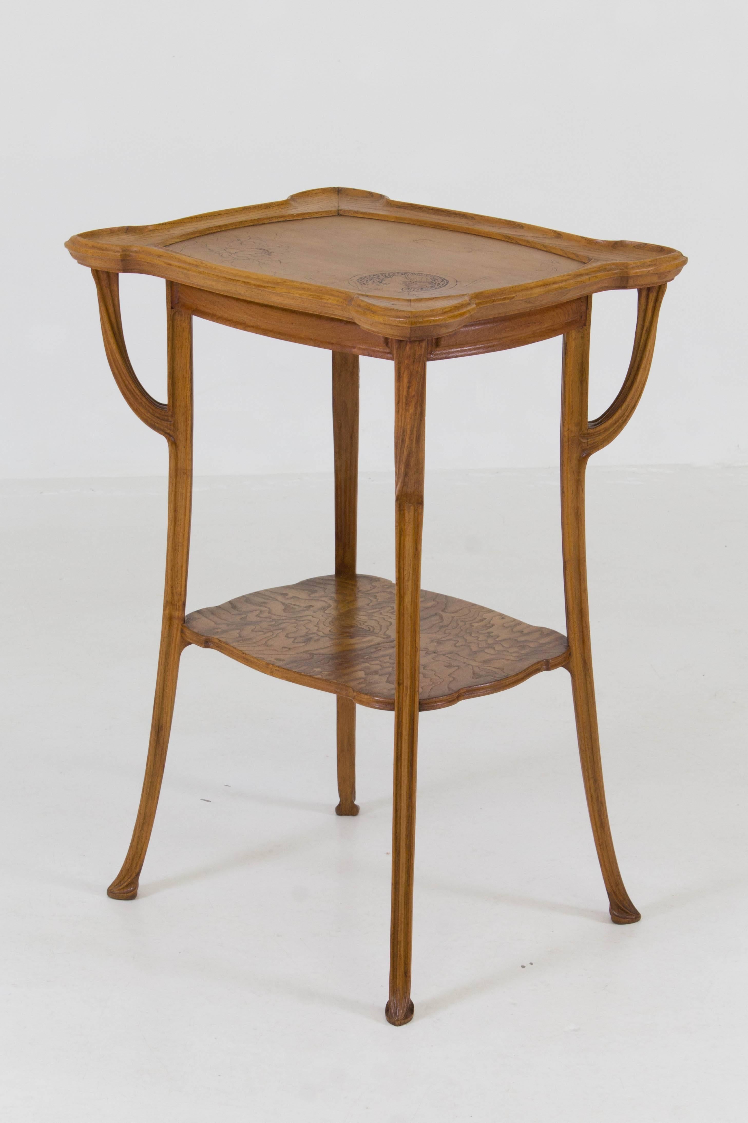 French Art Nouveau inlaid gueridon table, 1900s.
In the style of Emile Gallé.
Fruitwood with squared tapered legs.
In very good condition with minor wear consistent with age and use,
preserving a beautiful patina.