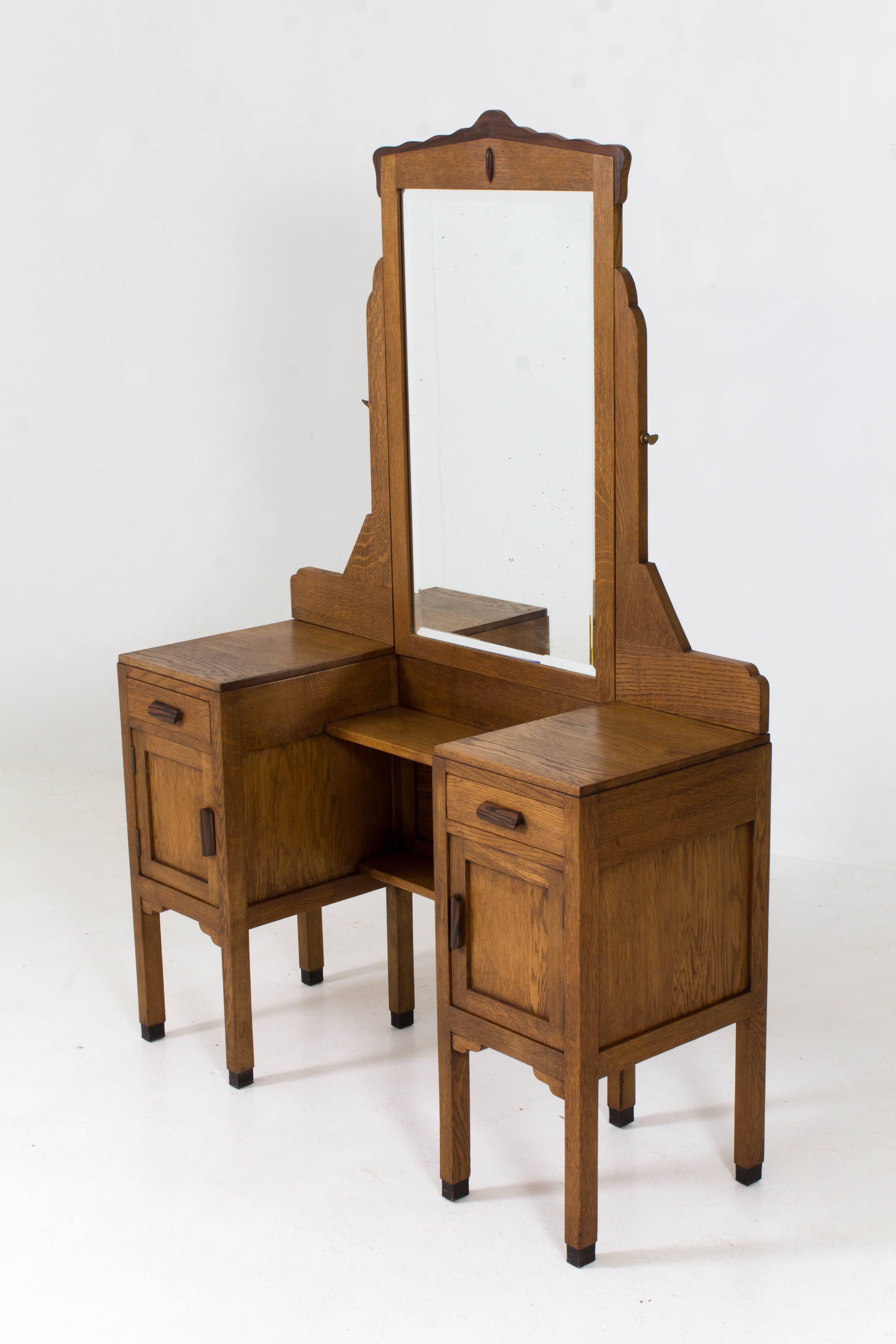 Stunning oak and ebony Macassar Art Deco Amsterdam School vanity or dressing table by Fa.Drilling Amsterdam, 1920s.
Original beveled mirror which is adjustable.
In very good condition with minor wear consistent with age and use,
preserving a
