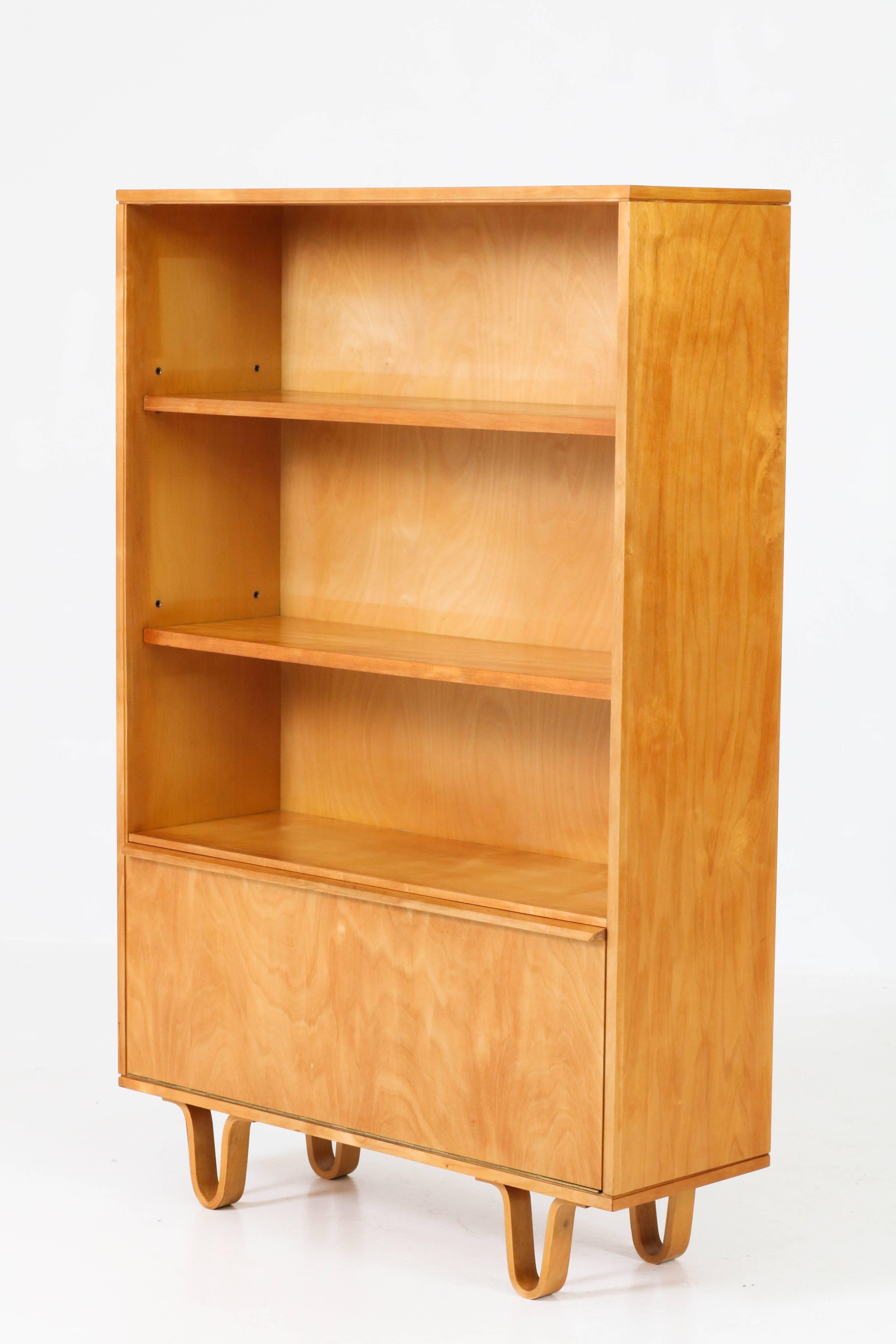 Stunning birch Mid-Century Modern BB03 bookcase by Cees Braakman for Pastoe, 1950s.
This design from the birch series is well known for the typical bended leg
Marked with metal tag.
Exept for some minor scratches on the top,in good condition with