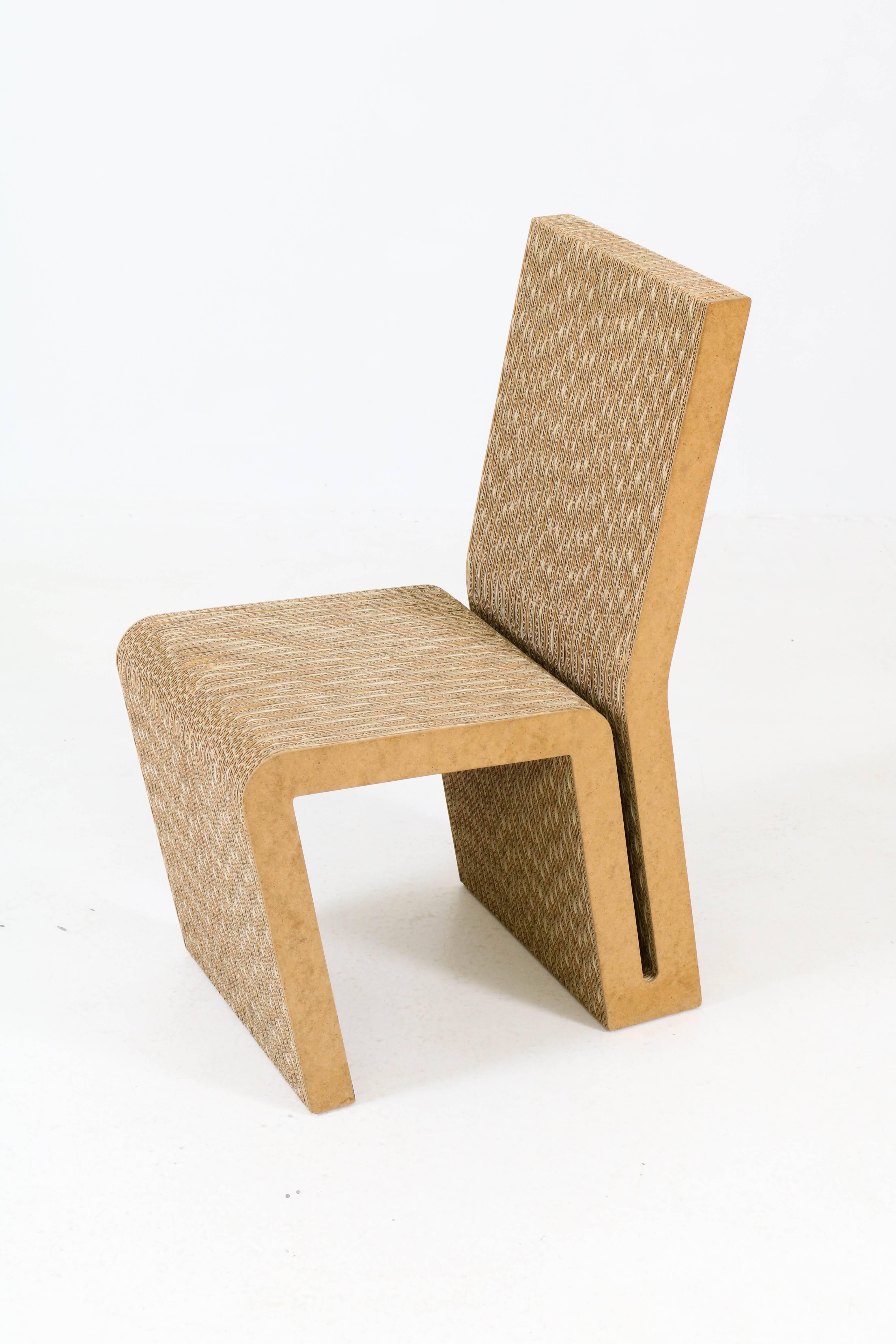 Iconic set of four easy edges chairs by Frank Gehry for Vitra, 2000.
Corrugated cardboard and masonite.
Marked with Vitra sticker underneath the chairs.
In good original condition with minor wear consistent with age and use,
preserving a