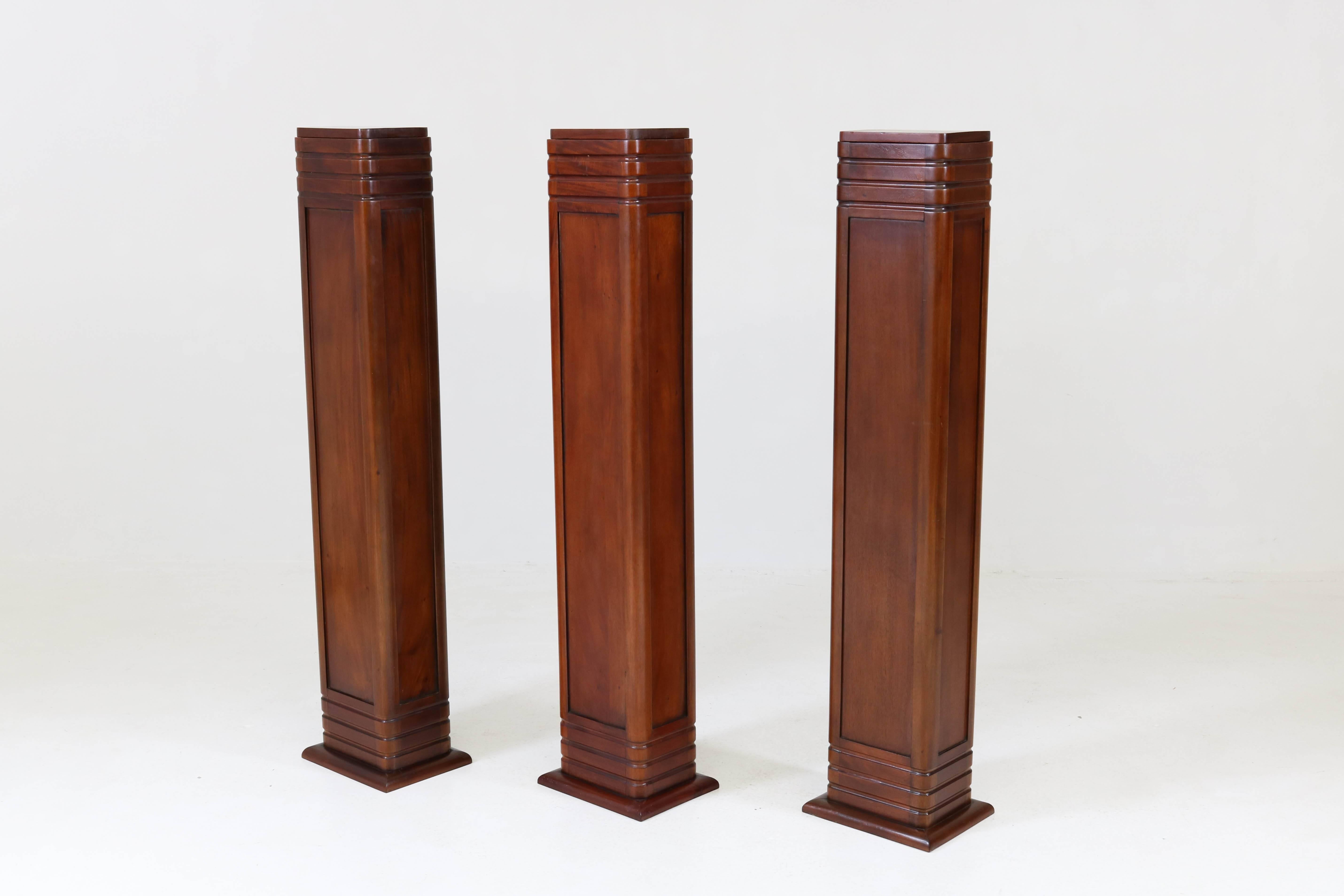 Stylish Art Deco Amsterdam School style pedestal, 1990s.
Striking design in solid mahogany.
We have three pedestals for sale.
Measurements top: 24 cm. / 9.45 in. by 18 cm./ 7.09 in.
In good original condition with minor wear consistent with age