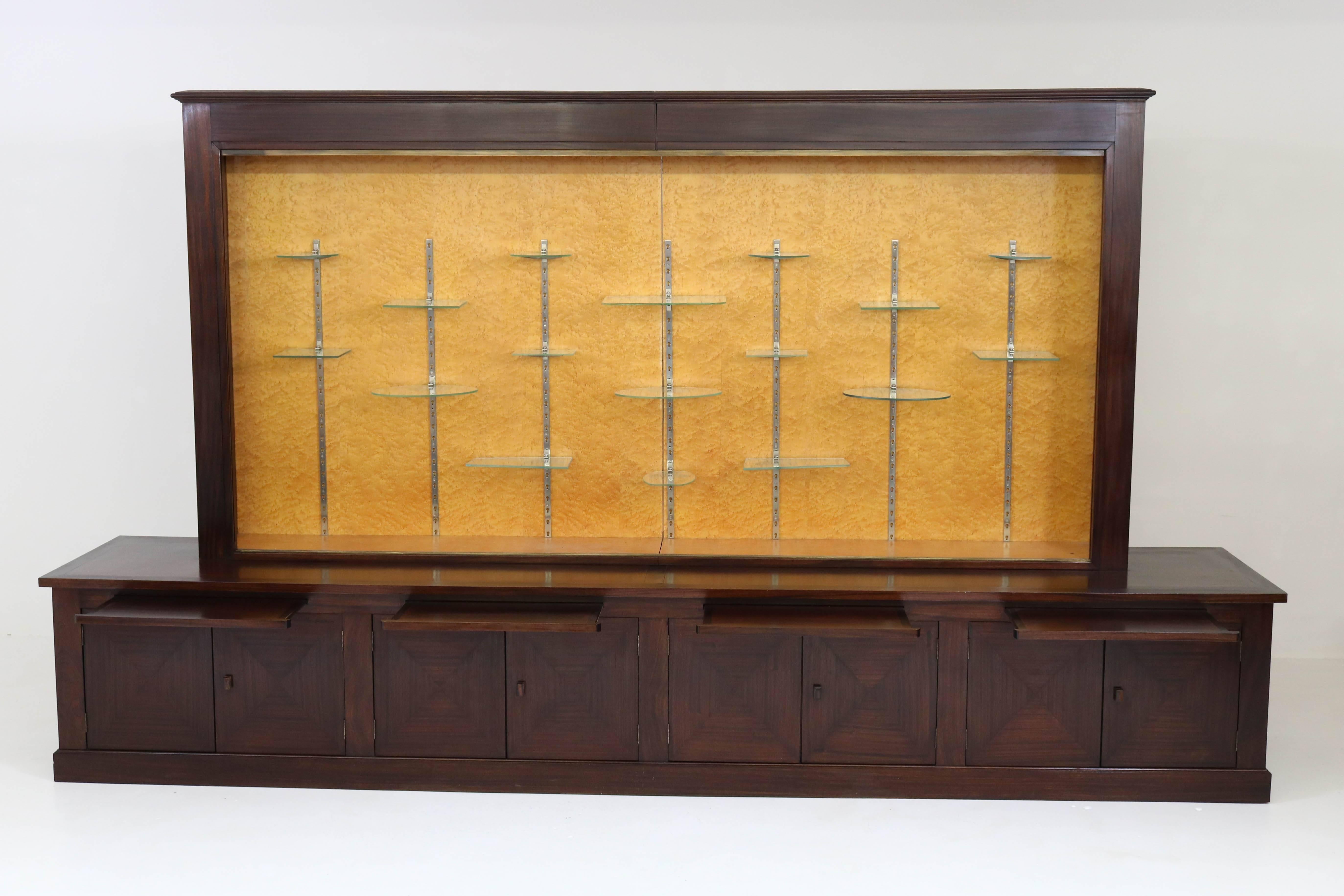 Very large and rare mahogany Art Deco Haagse School Vitrine with original glass sliding doors, 1920s.
This vitrine can be transported into two pieces.
Solid Macassar ebony handles on the doors.
Original glass shelves and nickel-plated brass