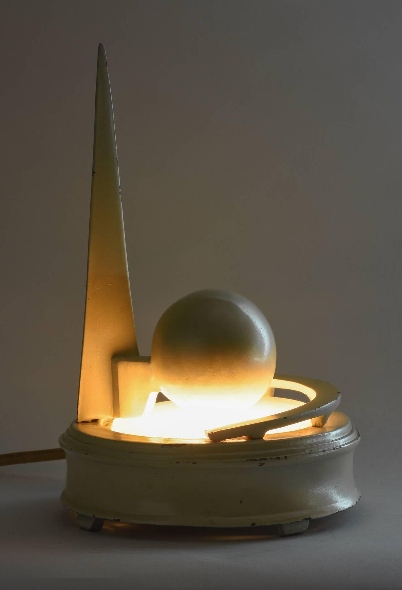 Extremely rare large Trylon and Perisphere lamp, 1939 New York World’s Fair, New York. 
Painted white metal and glass, 8-1/2” high, 1939.

Among the most distinctive and memorable New York buildings is one that no longer stands, the theme
