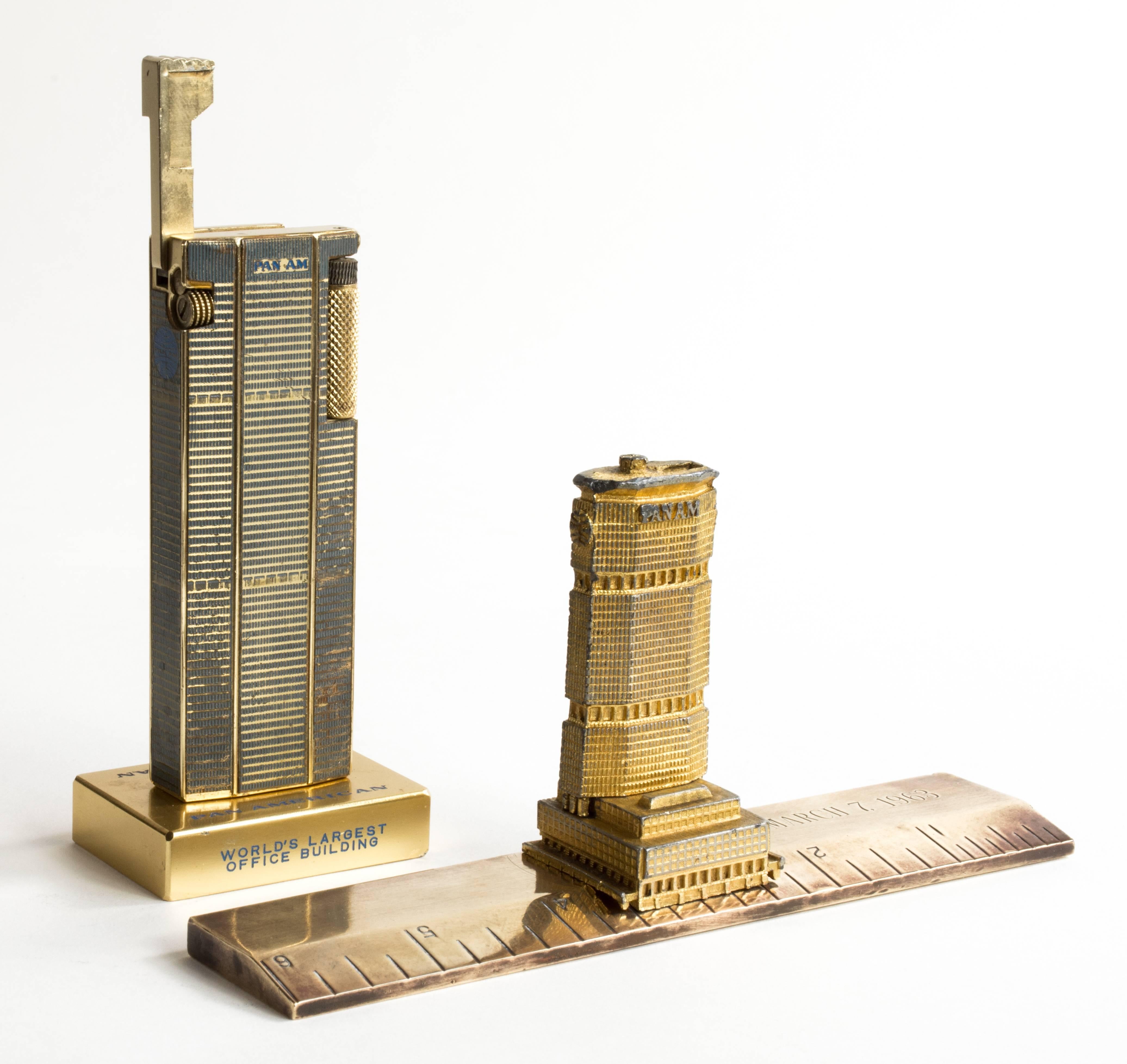 Pan Am Building Lighter & Ruler

Two Pan Am Building Souvenir Models, New York
Polished and painted brass lift-arm lighter
4 1/4