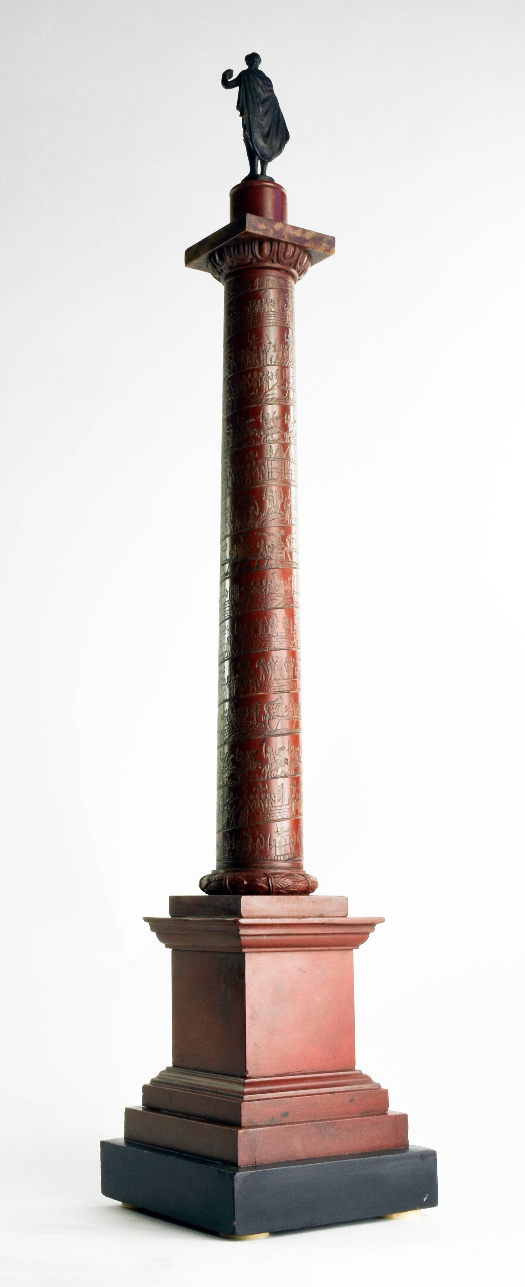 Early 19th century grand tour marble architectural model of Roman column.
Rosso and nero antico marble, with bronze figure.
Rome, circa 1820-1830, Measures: 22” H.

The triumphal column of Trajan, erected in Rome in 113 AD, has long been the subject