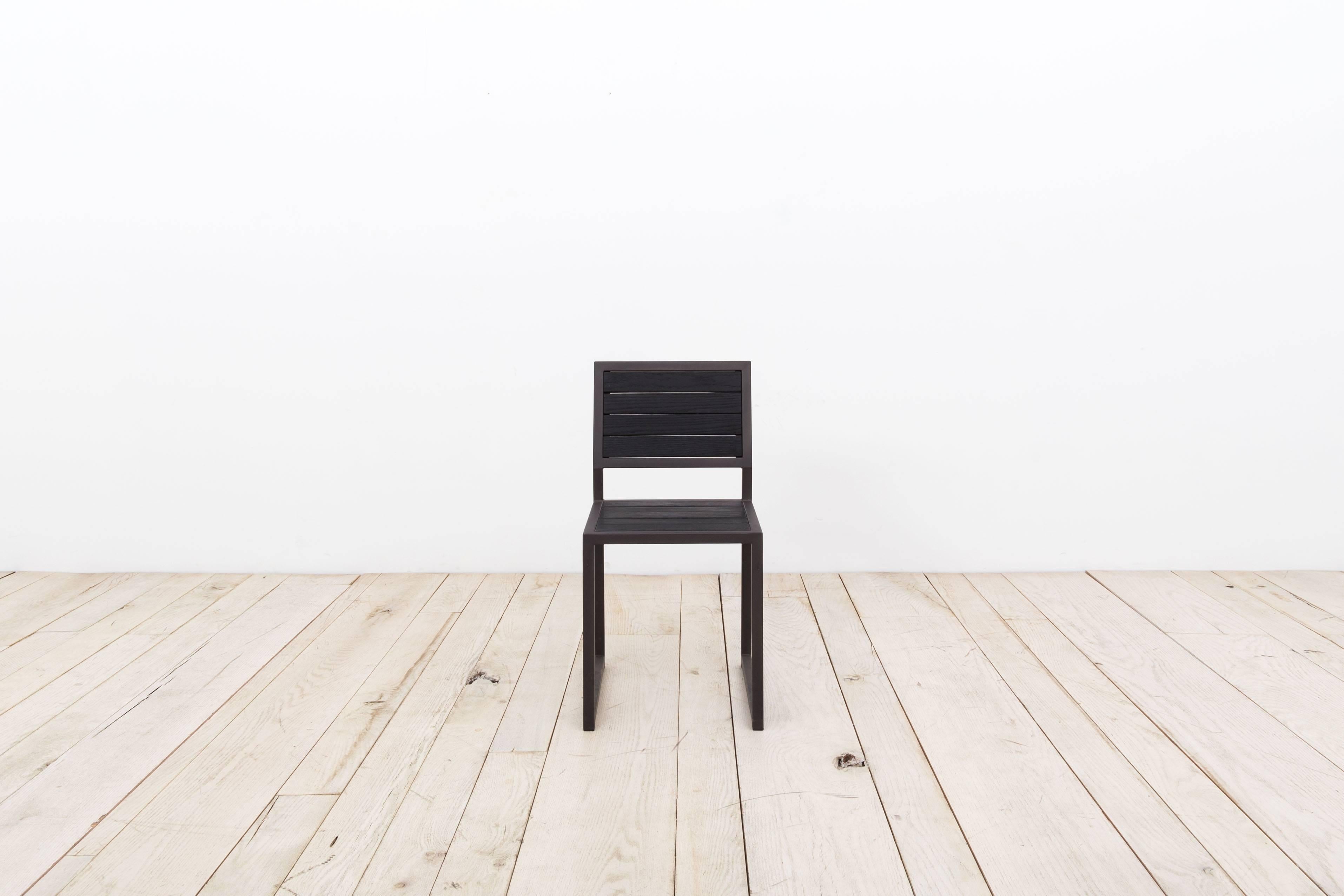 The 1x1 Chair is made from a 1 x 1 box tubing frame and inset wood seat and back. The low back and boxed leg has a distinctly contemporary look. 
