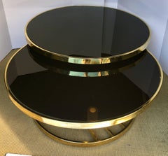 Design Institute America Round Two-Tier Swivel Brass and Glass Cocktail Table