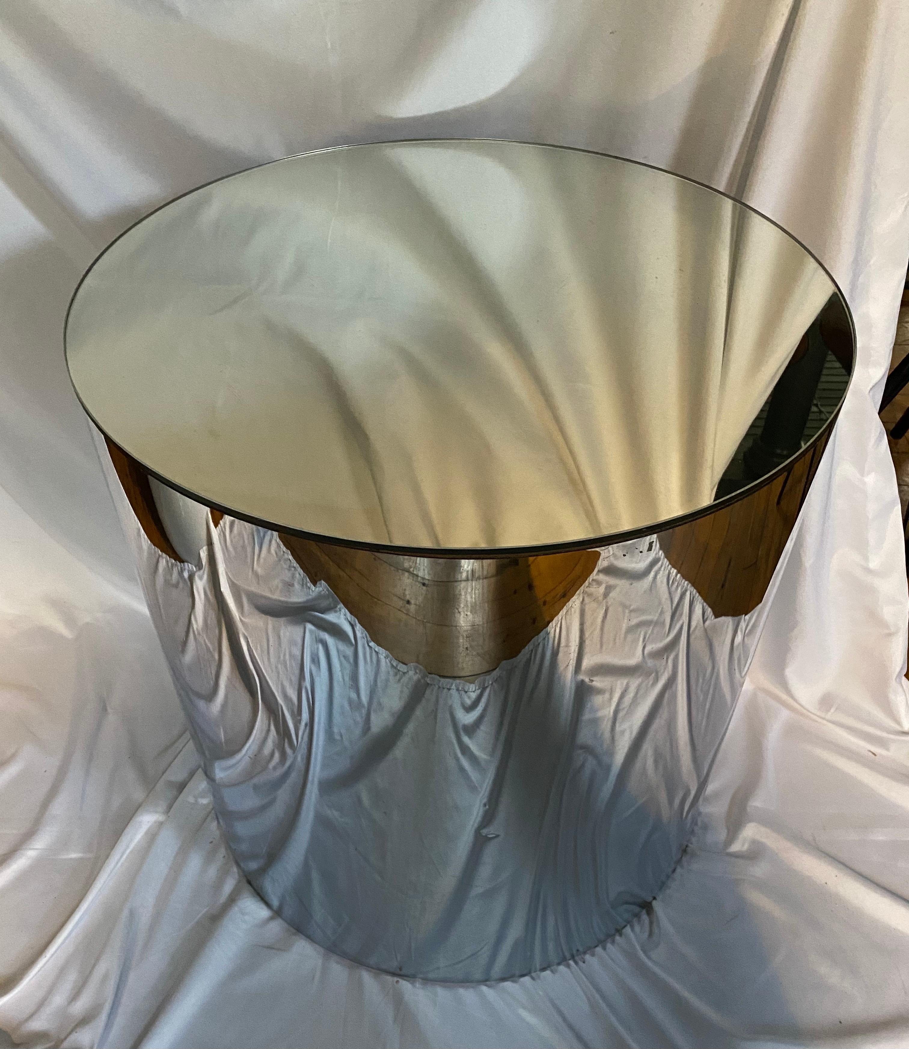 Mid Century Modern, Large sizable mirrored top drum side pedestal table wrapped in a reflective chrome metal metal.  In the style of Curtis Jere.  Circa 1970's.  Could be used as a side end table, center table, or display pedestal column.  