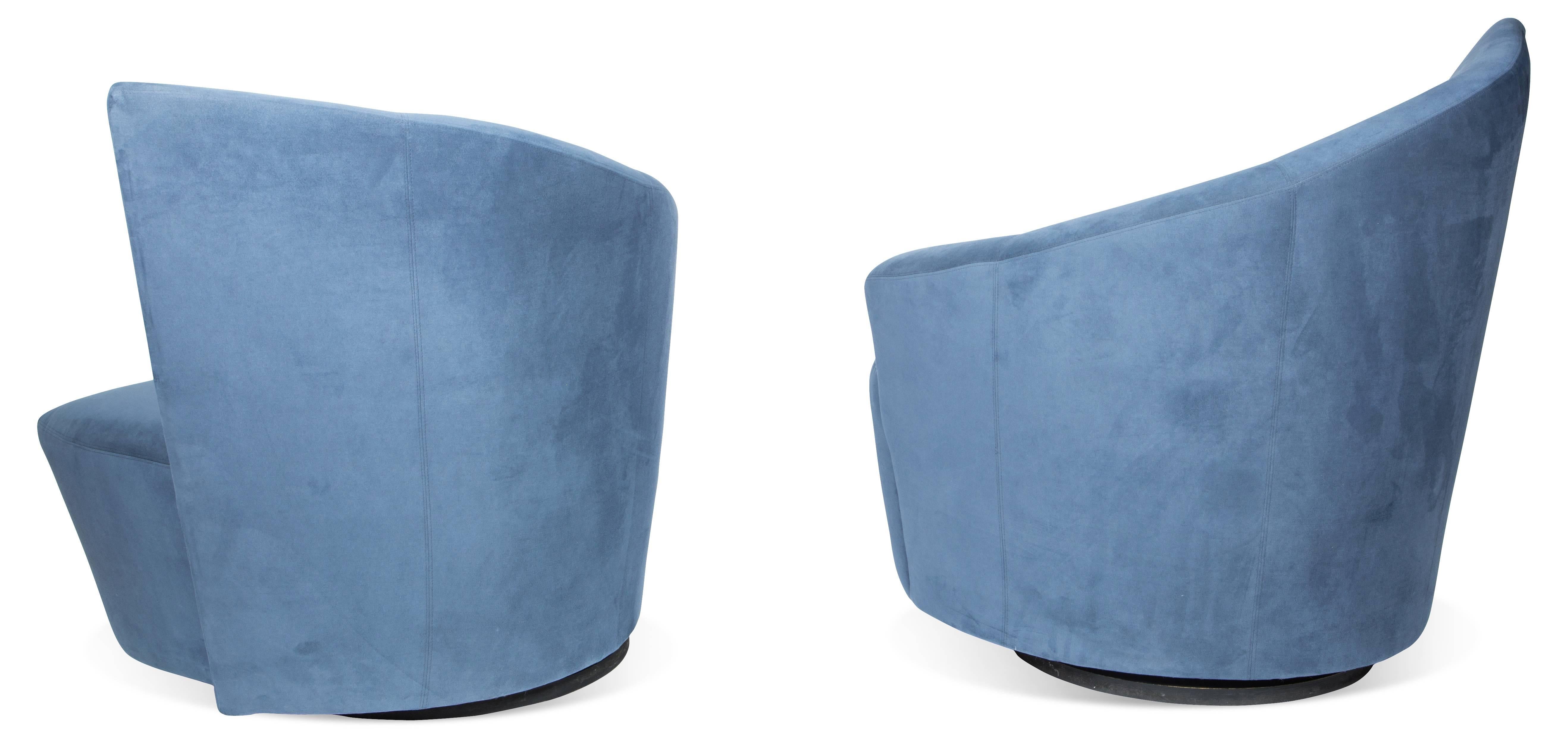 Pair of sculptural Bilbao swivel lounge chairs designed by Vladimir Kagan for Weiman preview features comfortable plush seats and curved angular backrests/armrests. The Bilbao collection was inspired by Frank Gehry's Guggenheim Museum in Bilbao,
