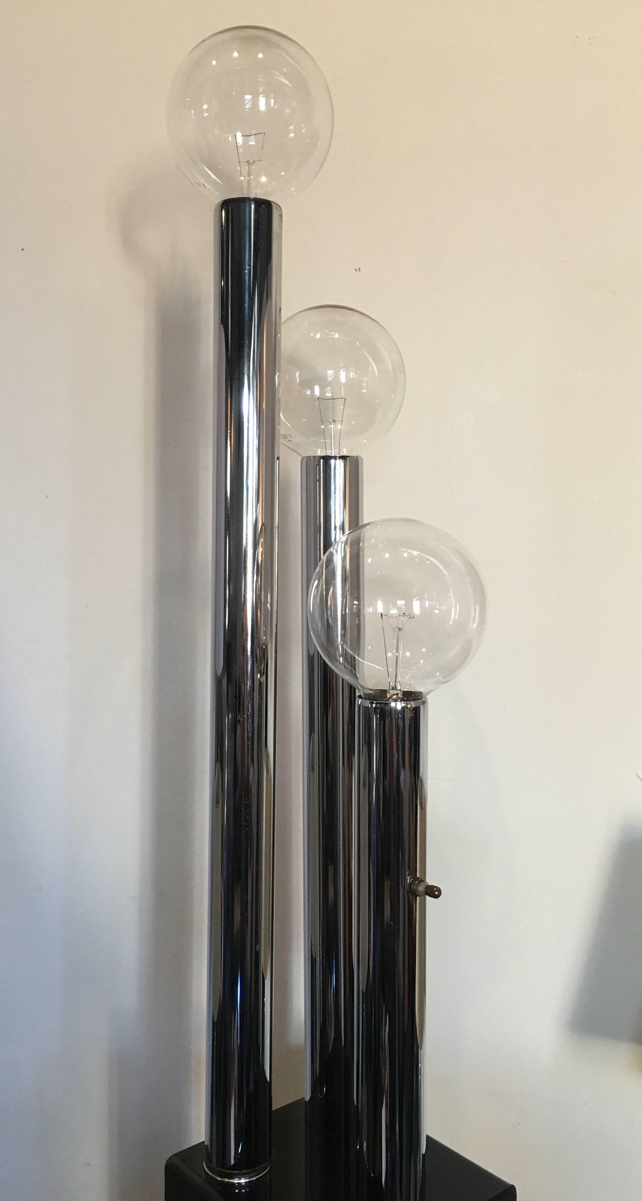 Mid-Century Modern sculptural chrome floor or table lamp with smoked acrylic base.  In the style of Vladimir Kagan.  Original wiring in working condition.  
