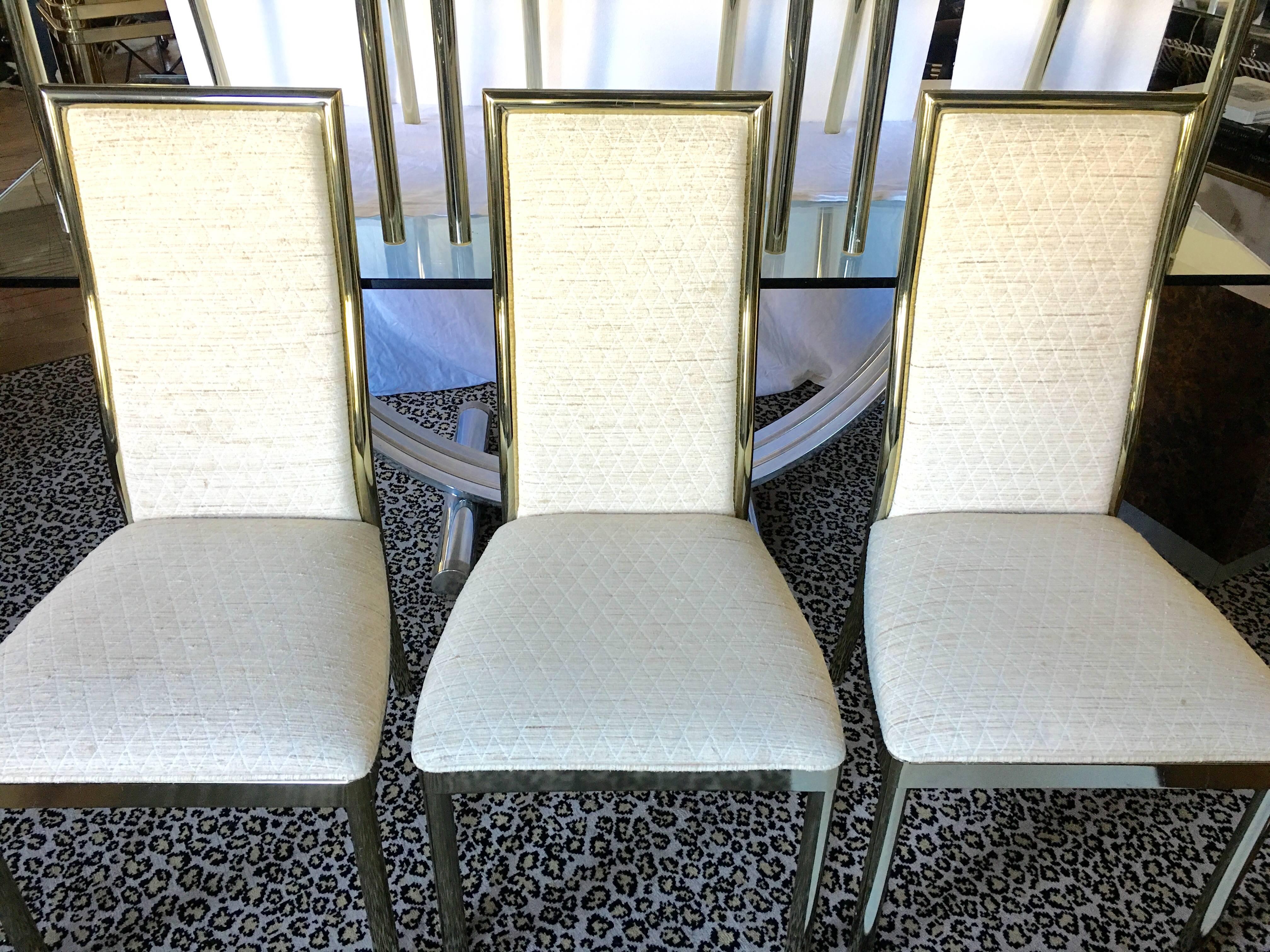 Set of six Mid-Century Modern armless brass plated metal dining side chairs in the style of Milo Baughman. Tubular frame with curved back. Original upholstery.
