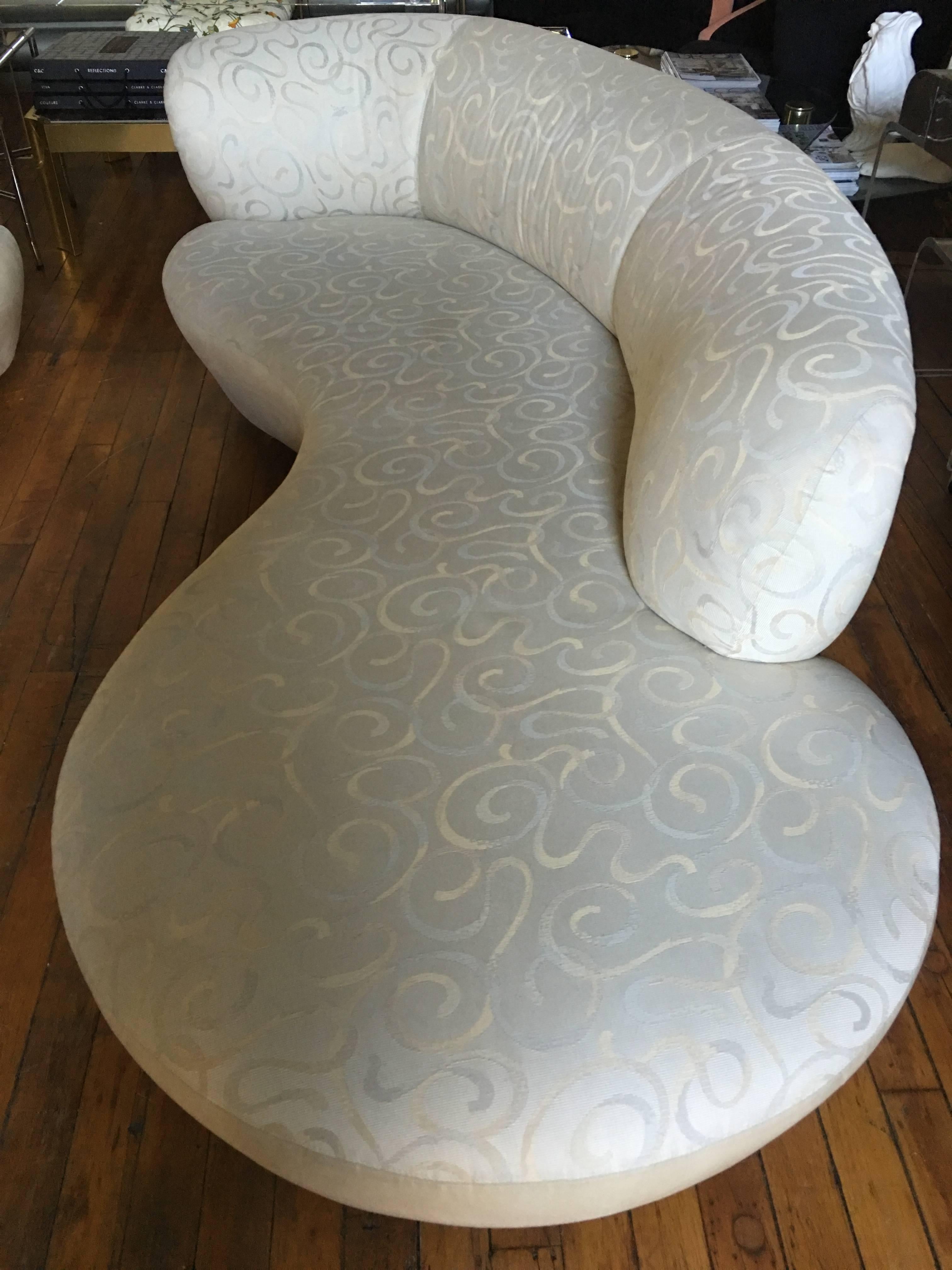 Sculptural pair of Mid-Century Modern free-form cloud curved sofas in the style of Vladimir Kagan for Weiman Preview. Pair includes one right arm and one left arm sofa. Original upholstery featuring neutral cream ultra-suede backs and fronts with