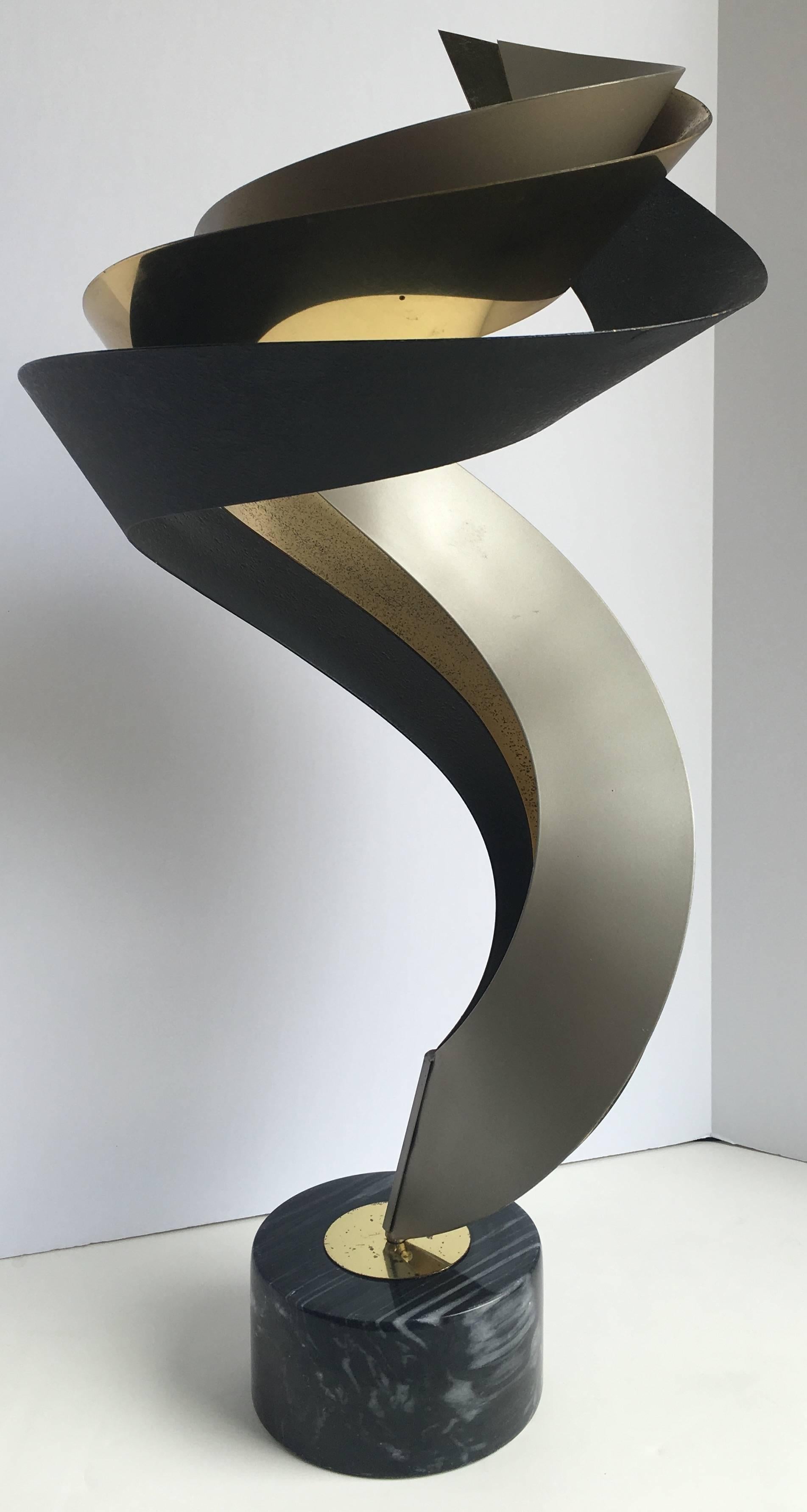 Mixed metal modern table sculpture by Curtis Jere featuring brass, black and matte silver. Polished marble base. No signature.
