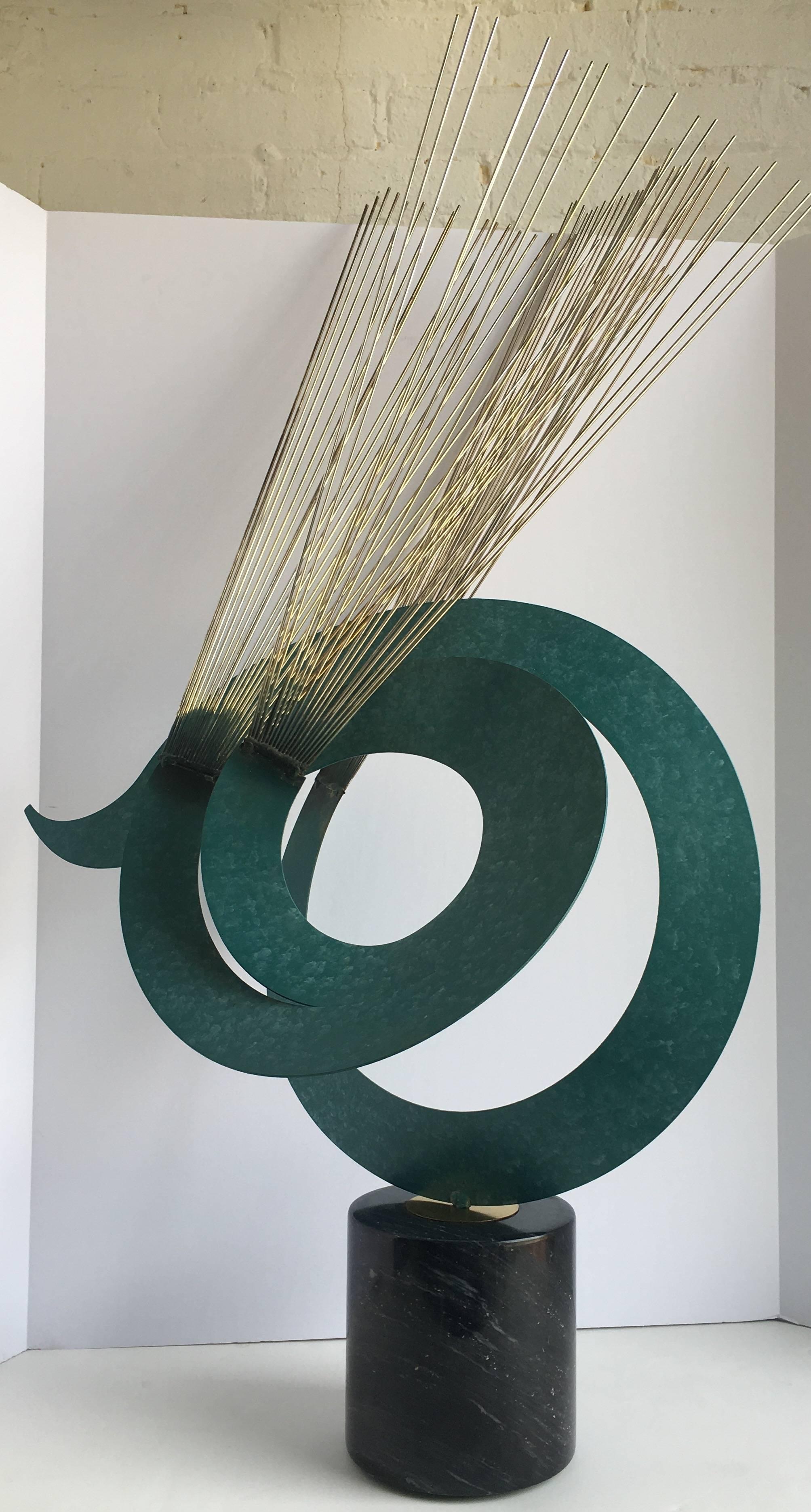 Dramatic modern abstract table sculpture featuring a curvaceous turquoise metal wave design with tubular brass rod sprays. Polished marble base. Signed and dated, 1980.