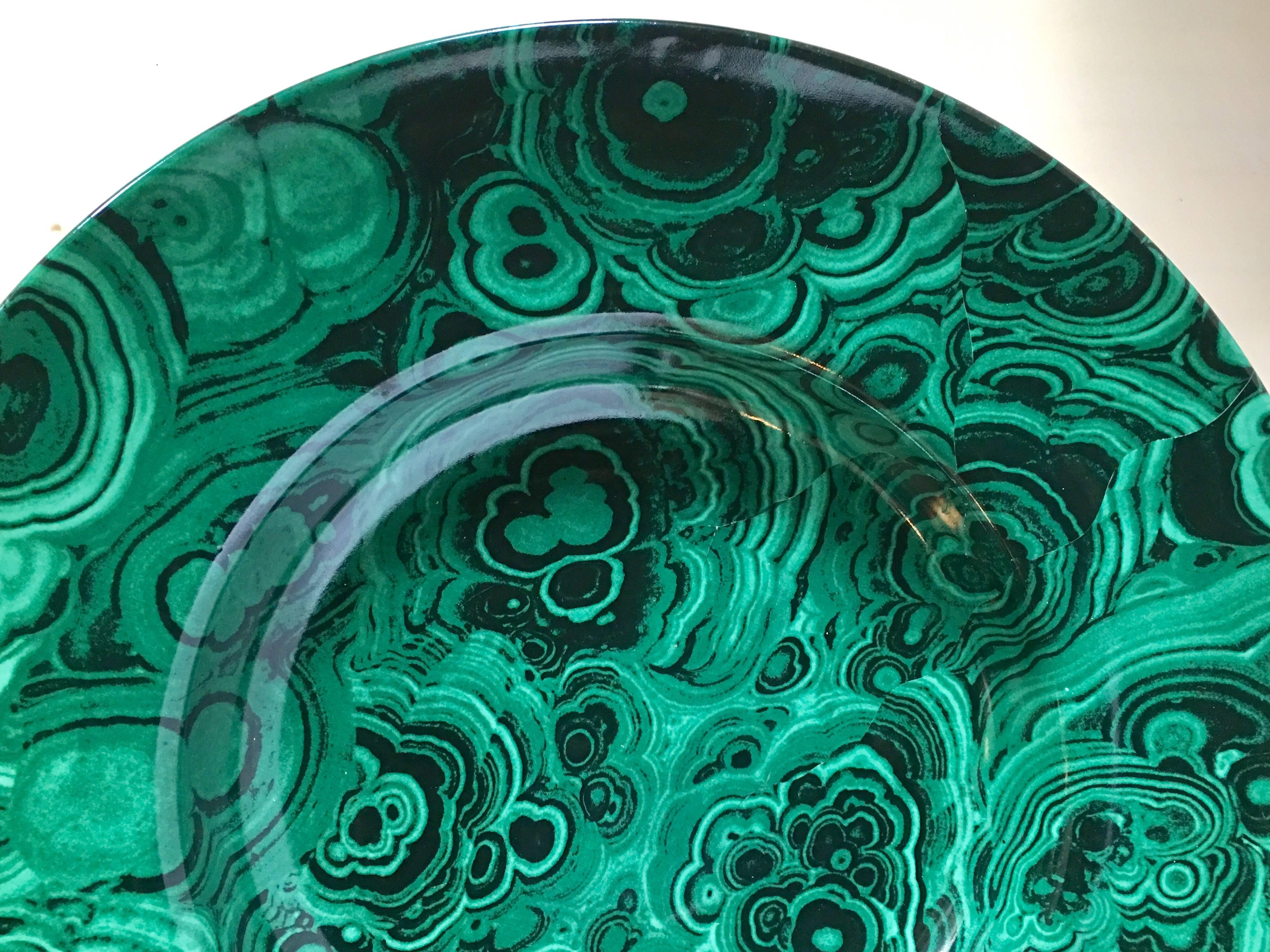 Large Mid-Century Modern round Italian serving plate or bowl featuring green faux malachite stone pattern. Bottom of dish marked Made in Italy.  This glazed ceramic plate is in the style of Piero Fornasetti.

  
