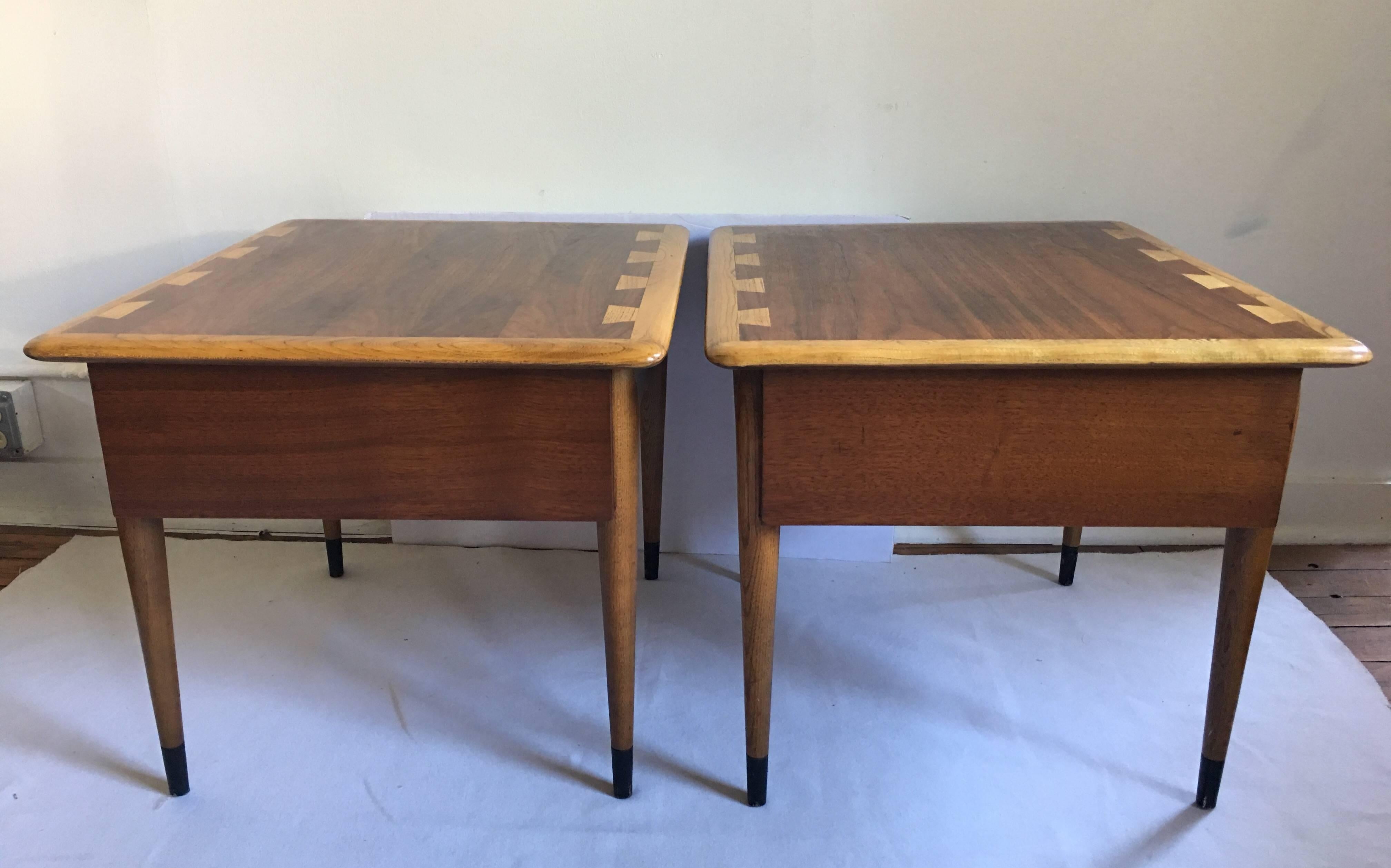 Pair of Danish inspired Lane AltaVista side tables designed by Andre Bus for Lane's iconic Acclaim series. Tables feature a two-tone top with an inset dark walnut veneer and solid oak bullnose edge with signature Acclaim decorative dovetails. These
