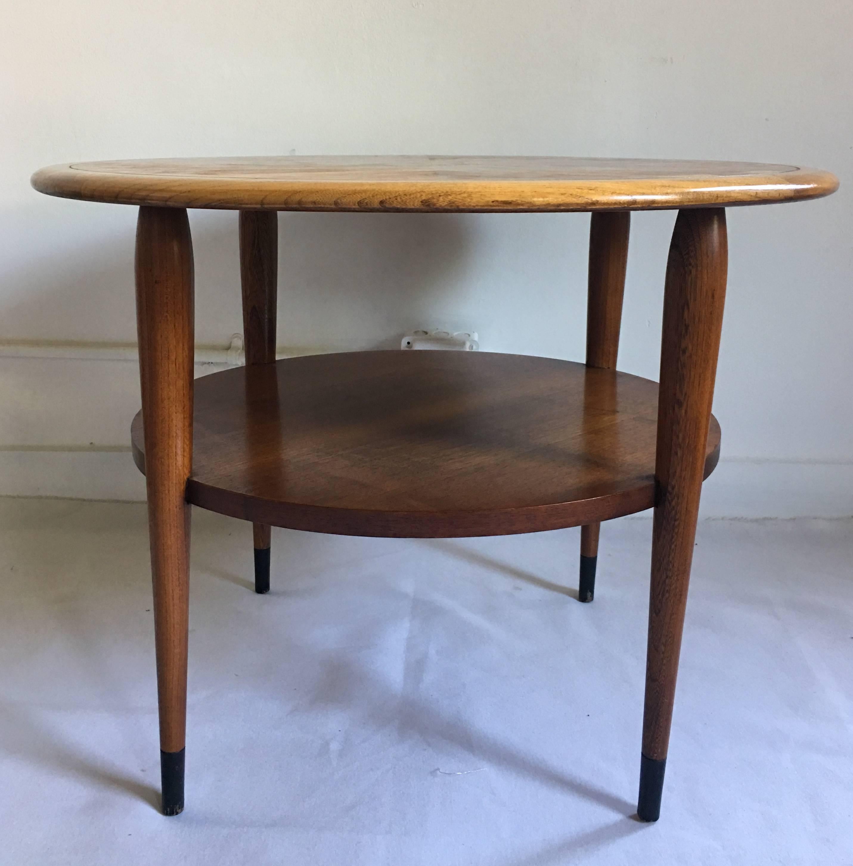 Danish inspired Lane AltaVista round side lamp table designed by Andre Bus for Lane's iconic Acclaim series. Table features a two-tone top with an inset dark walnut veneer and solid oak bullnose edge with signature Acclaim decorative dovetails. This