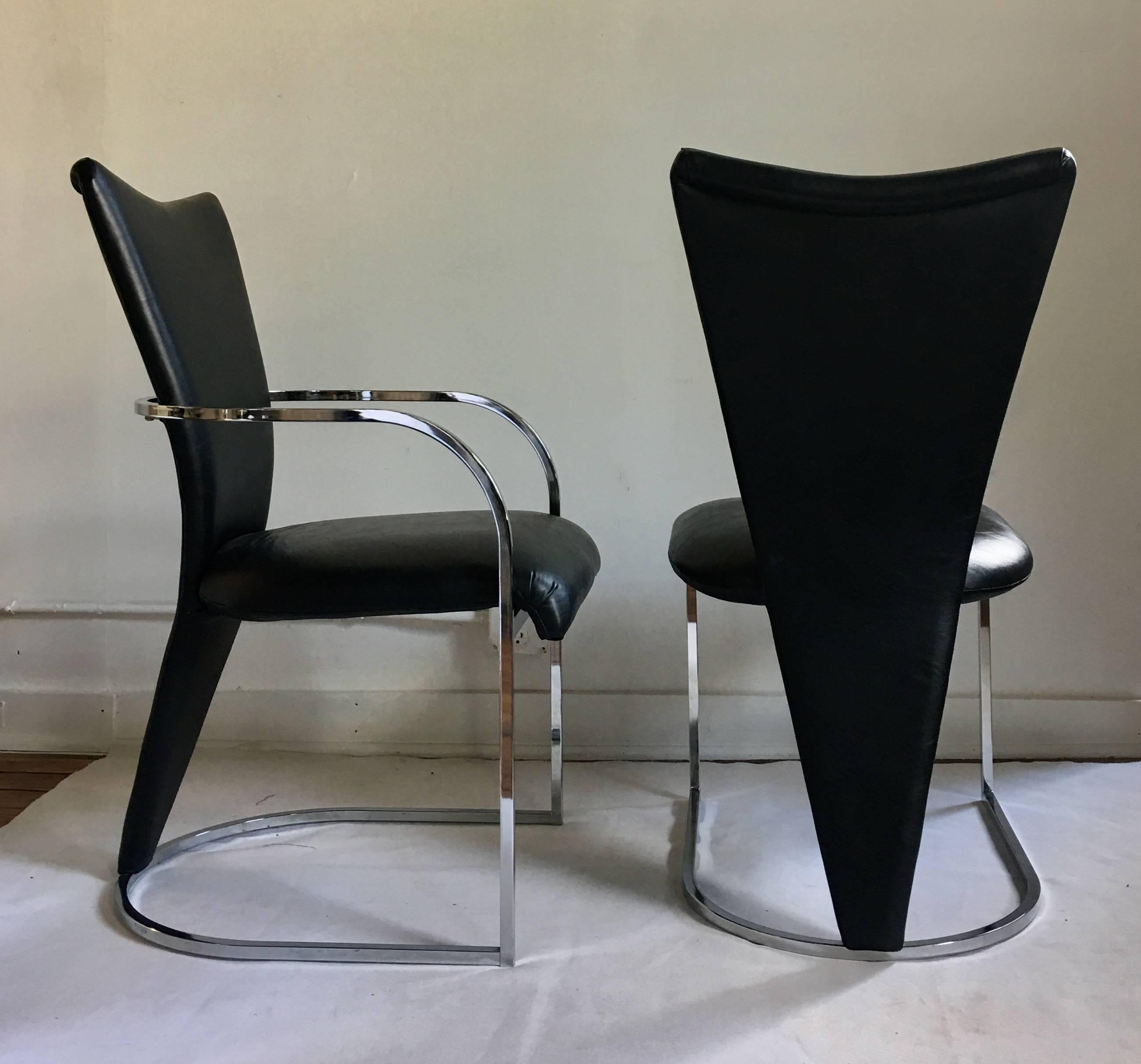 Set of six postmodern chromed steel dining chairs by DIA, Design Institute America. Set includes two arm chairs and four armless side chairs. Influenced by the designs of the Memphis Group, these sculptural chairs feature a curved triangular rolled