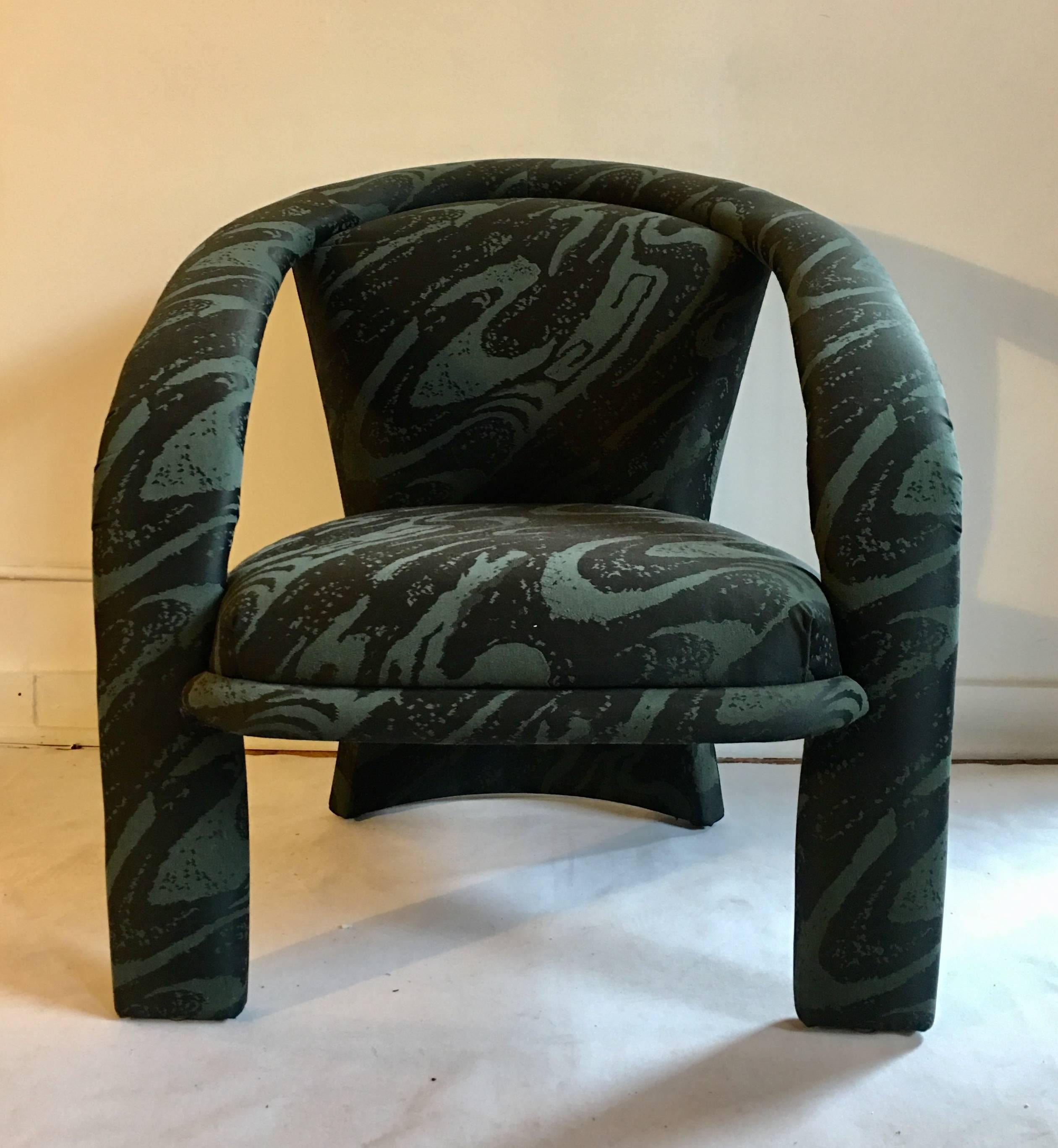 Modern Hollywood Regency style accent or lounge chair by Carsons. This unique sculptural design features a three leg curved frame upholstered in original malachite like green swirl upholstery. Original manufacturer label. In the style of Kelly